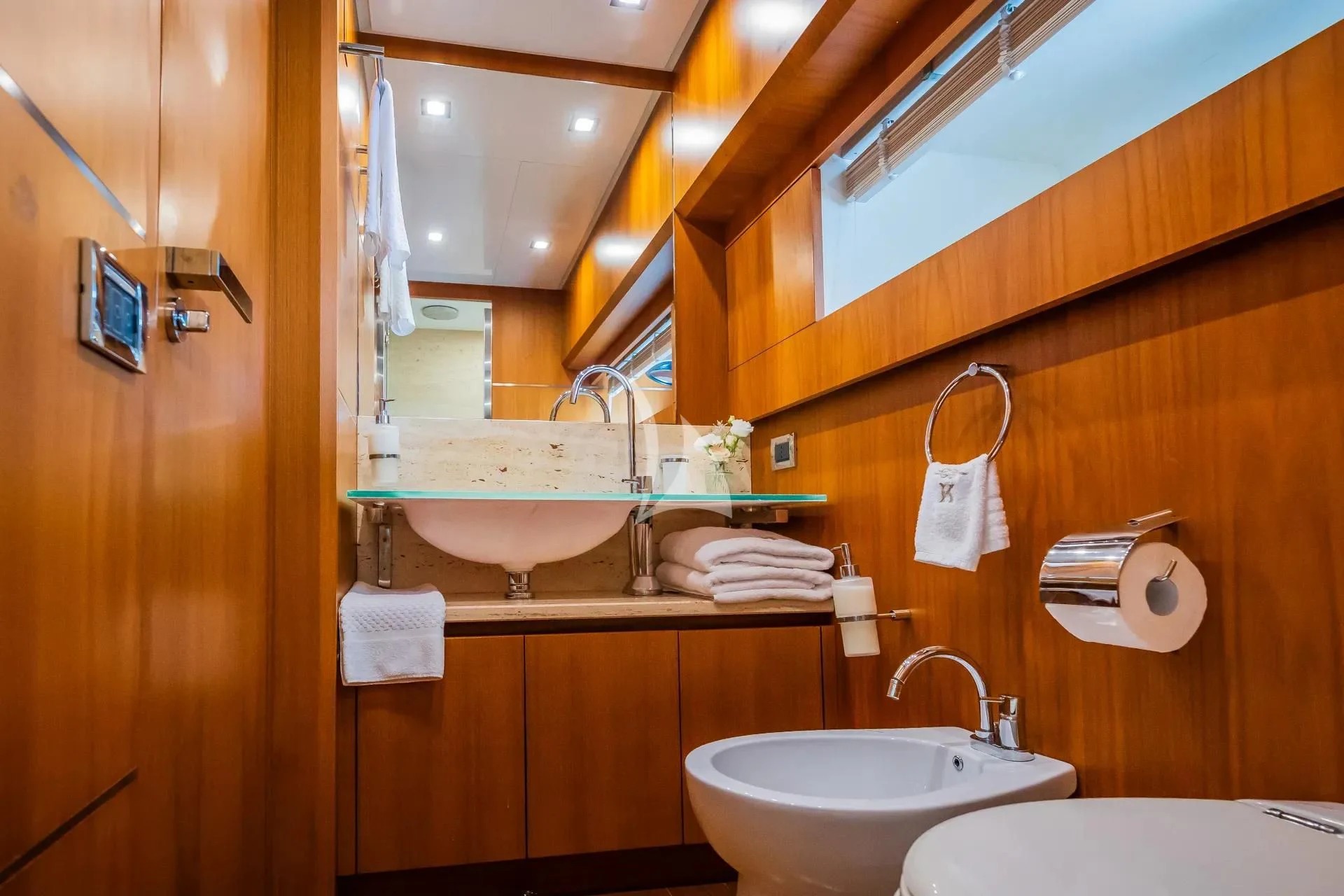a bathroom with a mirror and a sink aboard KARISMA Yacht for Sale