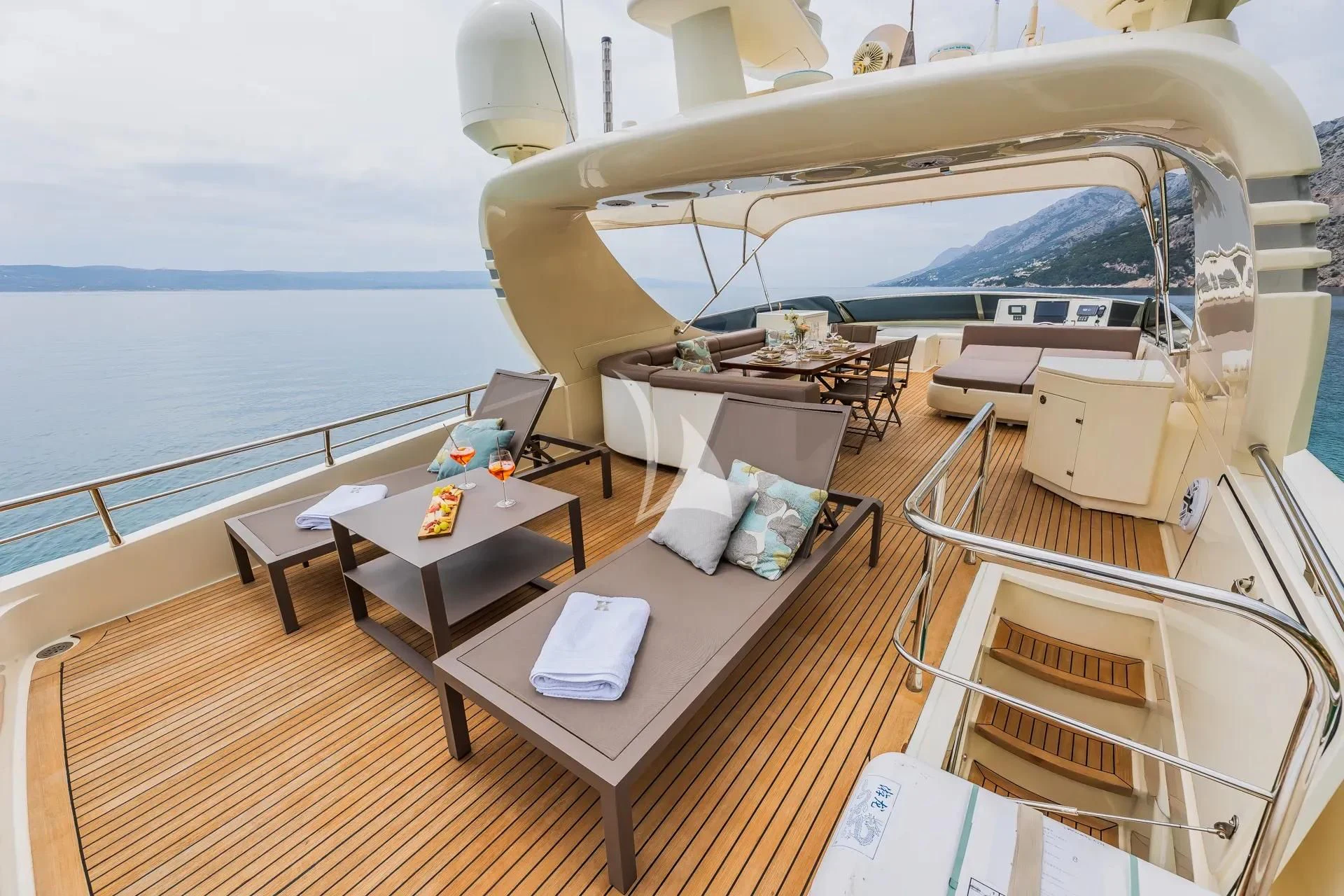a room with a table and chairs aboard KARISMA Yacht for Sale