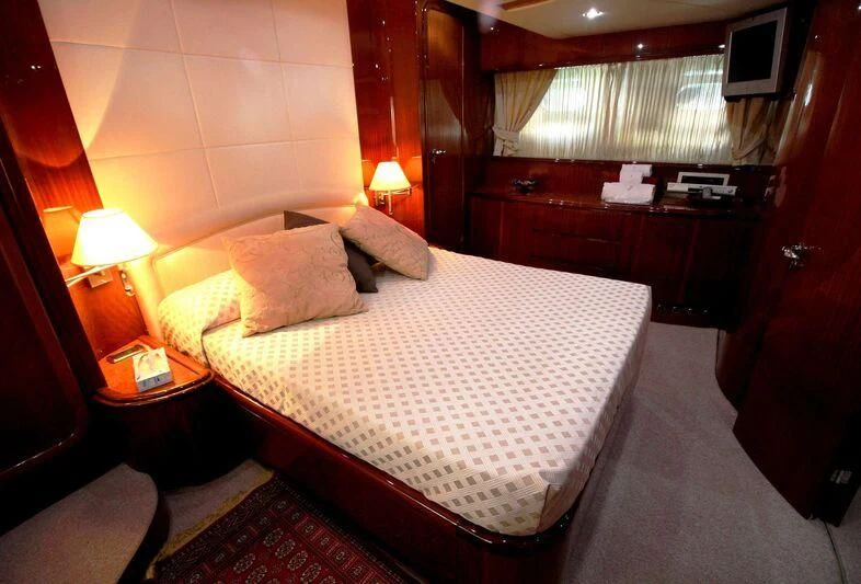 a bed in a hotel room aboard JAUNI Yacht for Sale