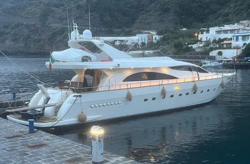 a white yacht in the water aboard JAUNI Yacht for Sale