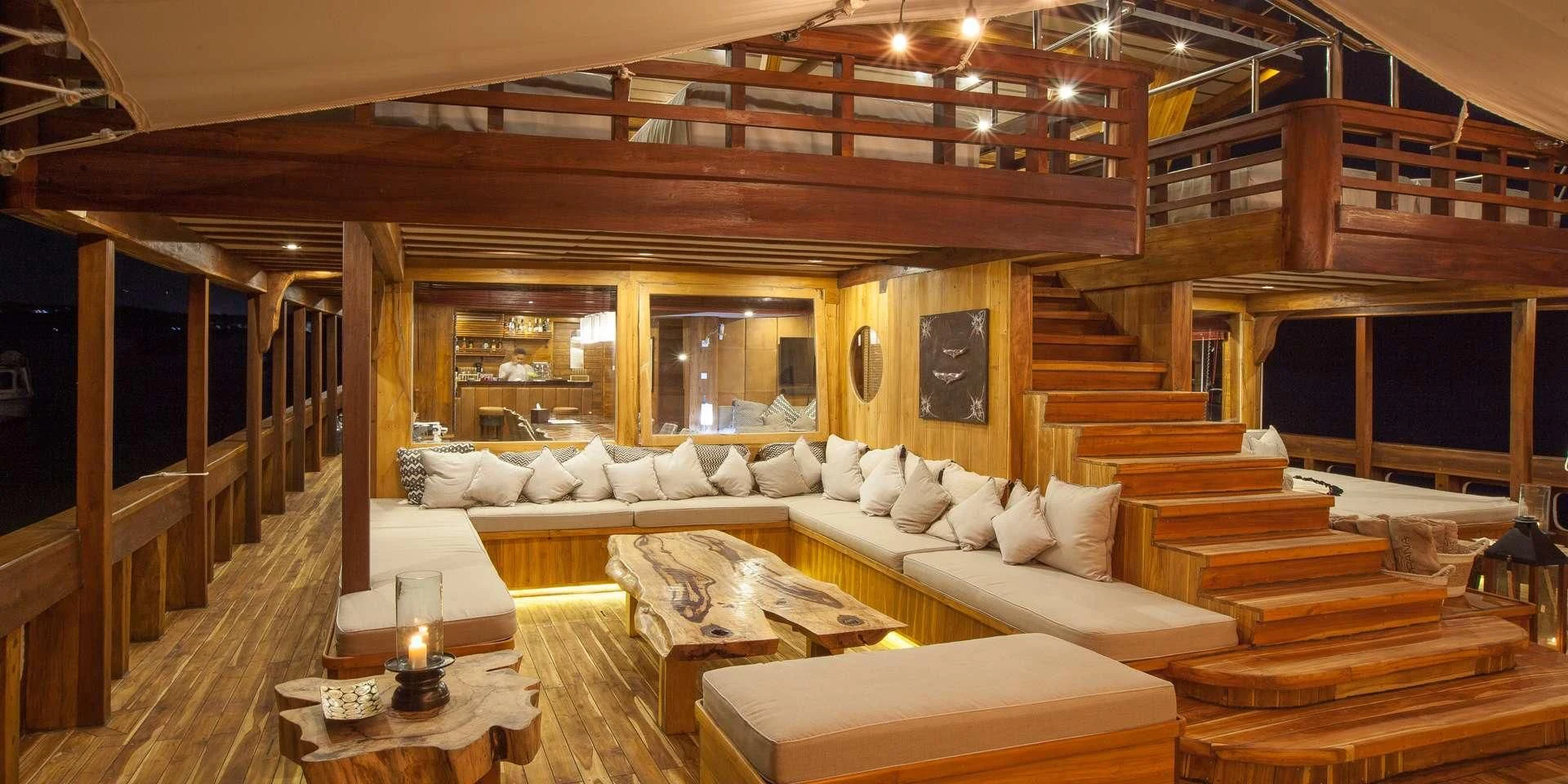 a large room with a couch and a table aboard PRANA Yacht for Charter