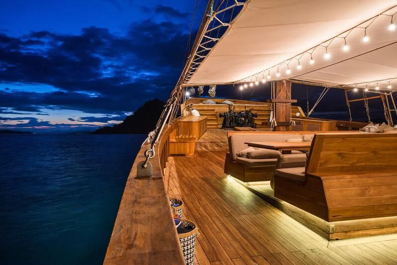 a deck with a view of the ocean and the ocean aboard PRANA Yacht for Charter