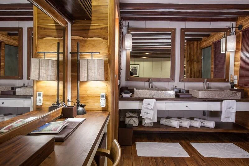a bathroom with a sink and a mirror aboard PRANA Yacht for Charter