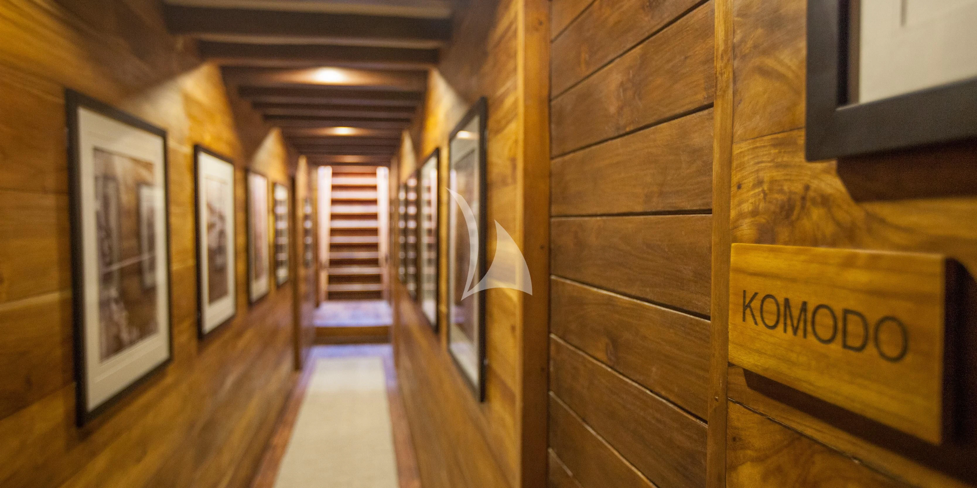 a hallway with wood walls aboard PRANA Yacht for Charter