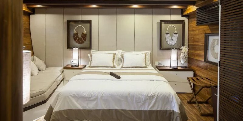 a room with two beds aboard PRANA Yacht for Charter