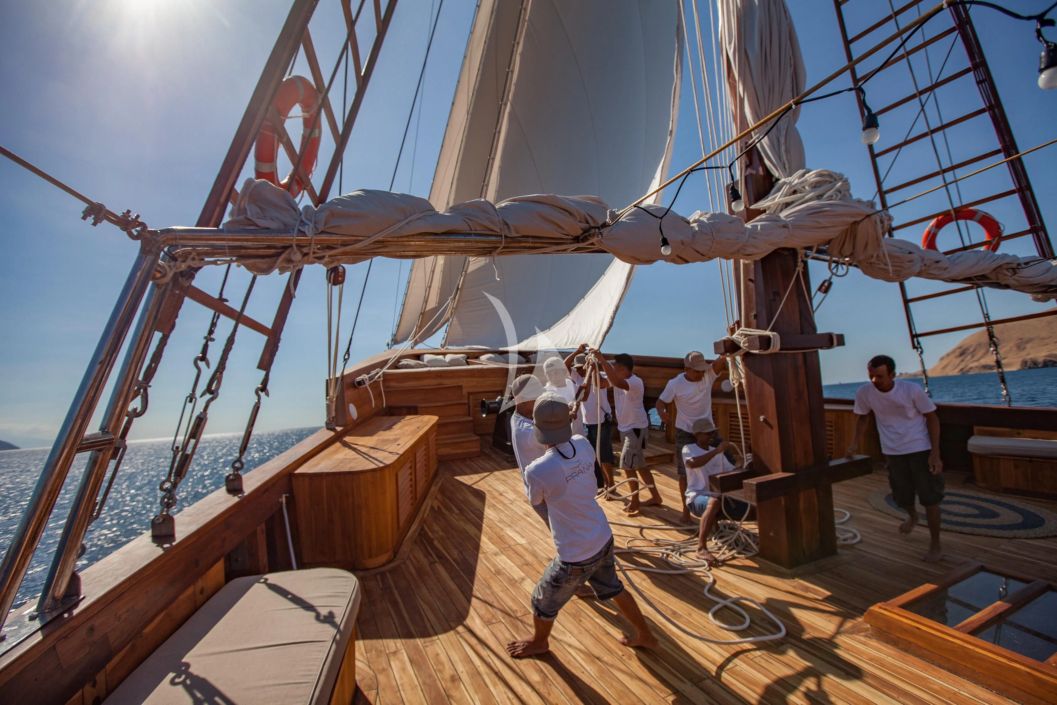 a group of people on a boat aboard PRANA Yacht for Charter