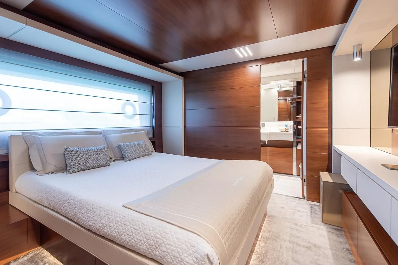 a bed in a room aboard NO SAUCE Yacht for Sale