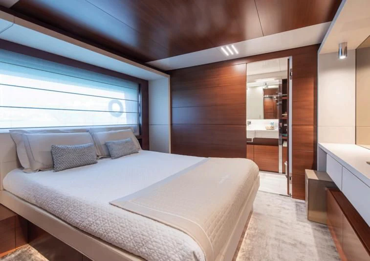 a bed in a room aboard NO SAUCE Yacht for Sale