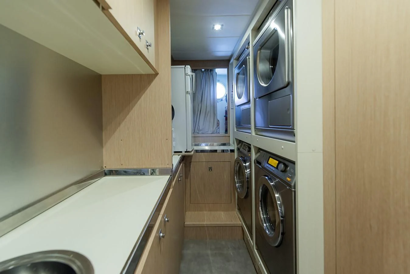 a kitchen with a stainless steel oven aboard NO SAUCE Yacht for Sale