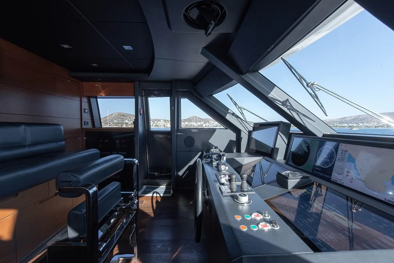 inside of a vehicle with a large window and a view of the city aboard NO SAUCE Yacht for Sale