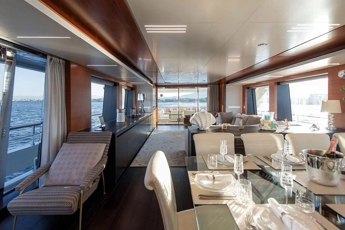 a restaurant with a table and chairs aboard NO SAUCE Yacht for Sale