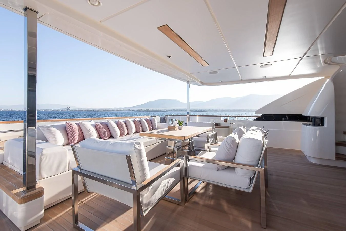 a room with a bed and a table aboard NO SAUCE Yacht for Sale