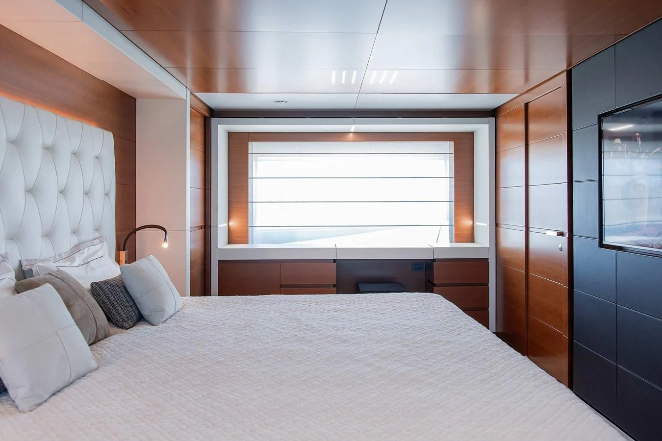 a bed with white sheets aboard NO SAUCE Yacht for Sale