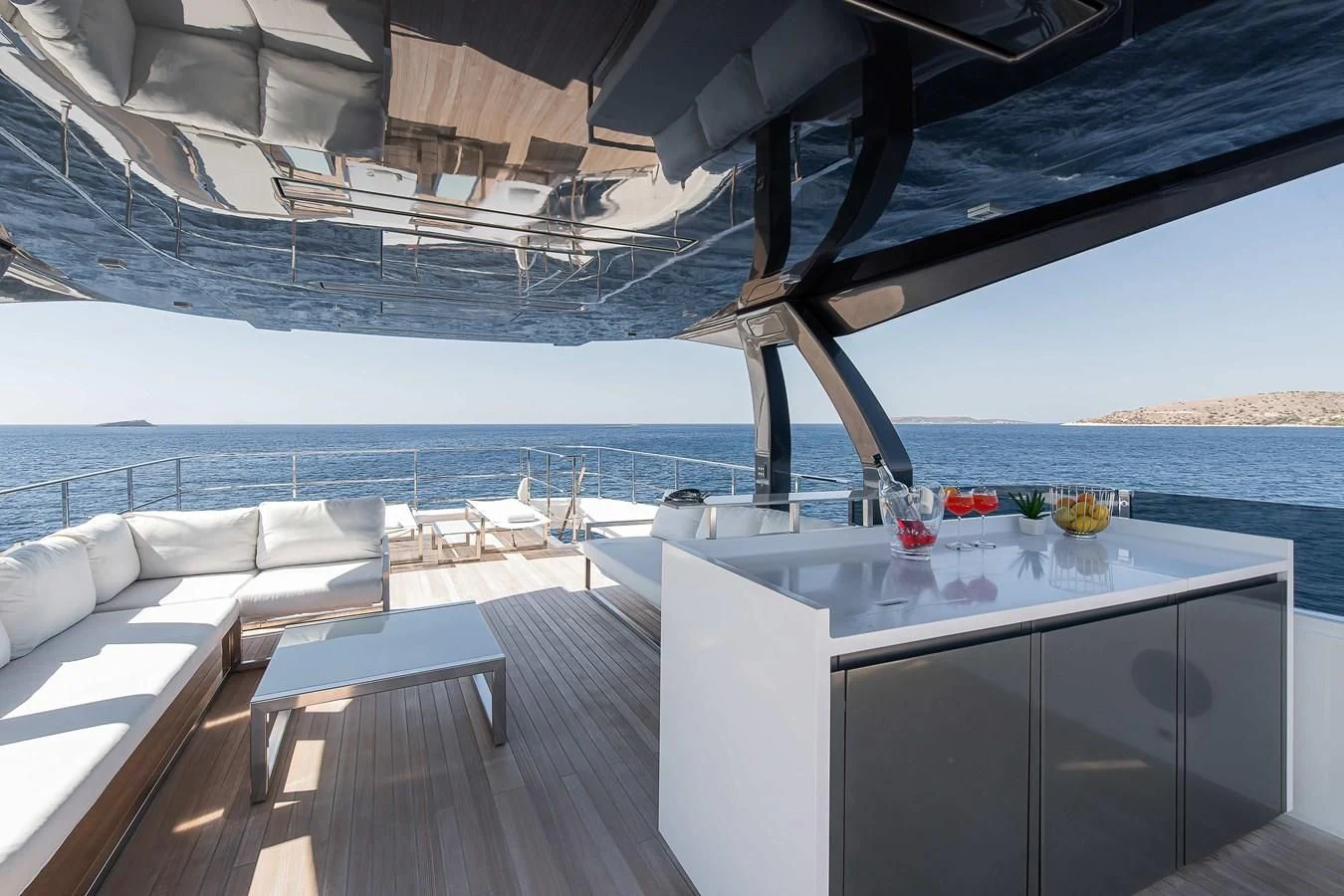 a deck with a view of the ocean and the deck aboard NO SAUCE Yacht for Sale