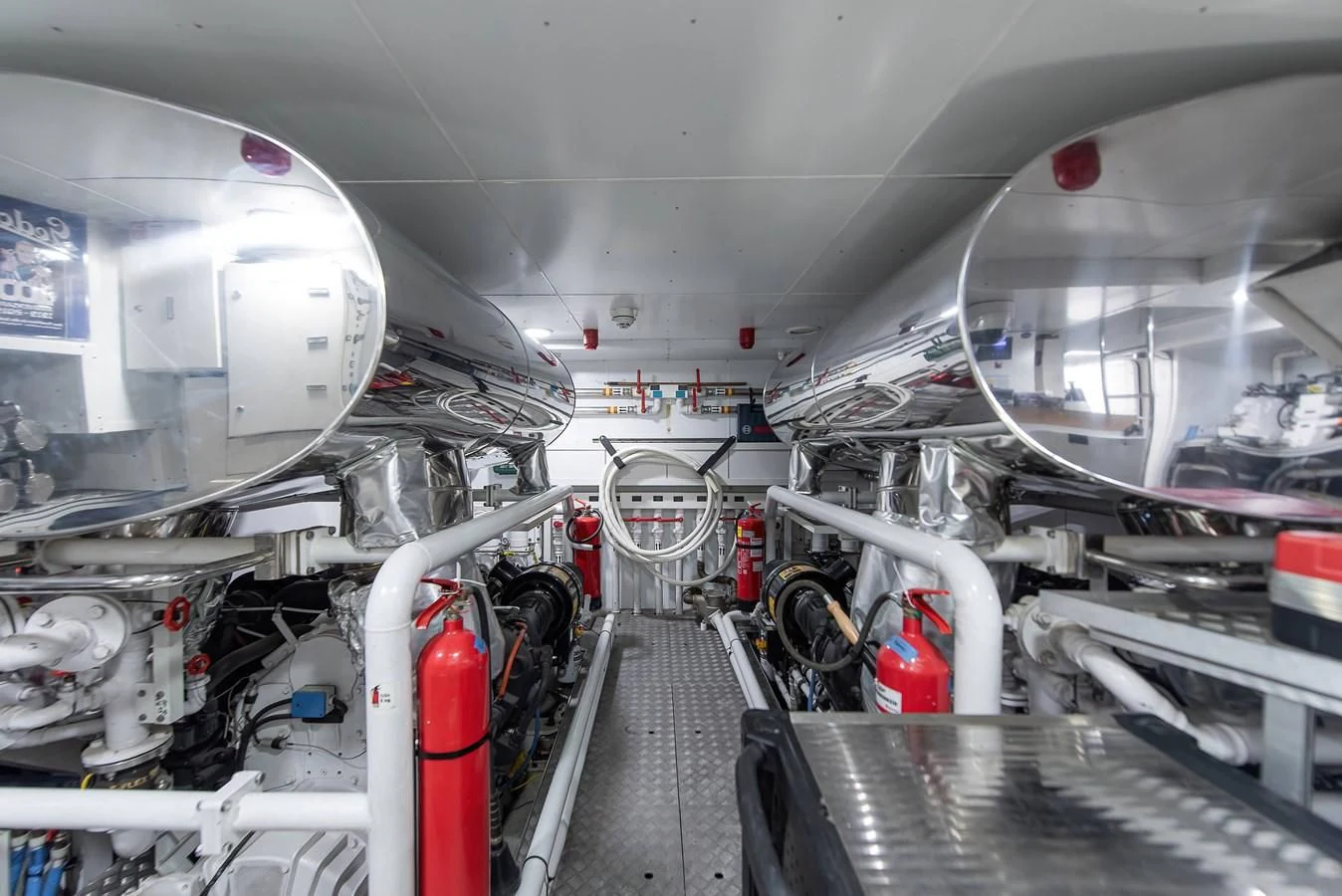 a large white machine in a room aboard NO SAUCE Yacht for Sale
