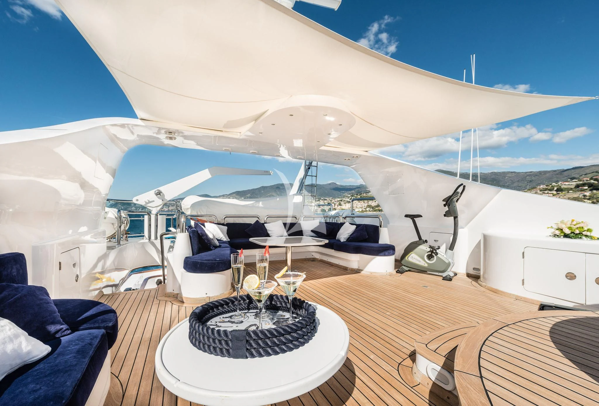 a large white tent with a table and chairs in front of it aboard DESAMIS B Yacht for Sale