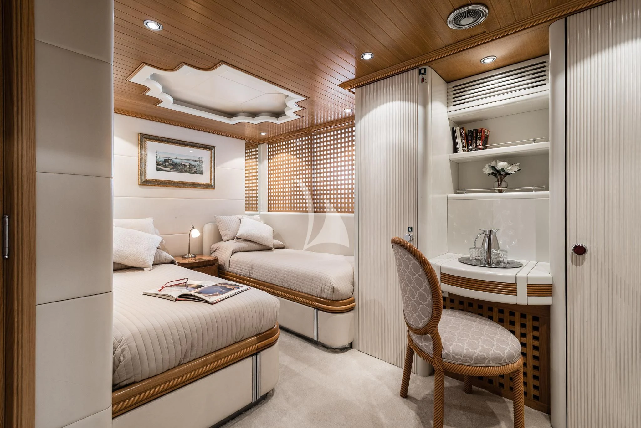 a room with a bed and a chair aboard DESAMIS B Yacht for Sale