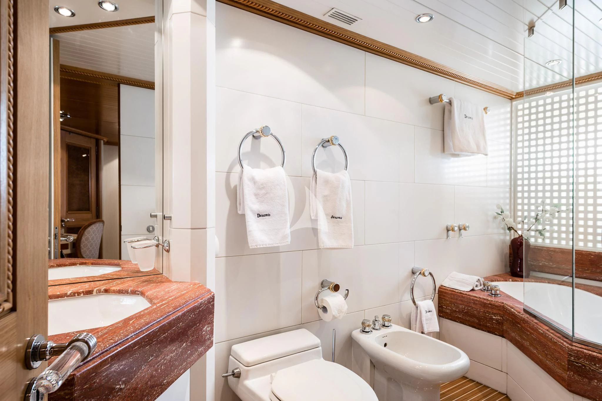 a bathroom with a sink toilet and bathtub aboard DESAMIS B Yacht for Sale