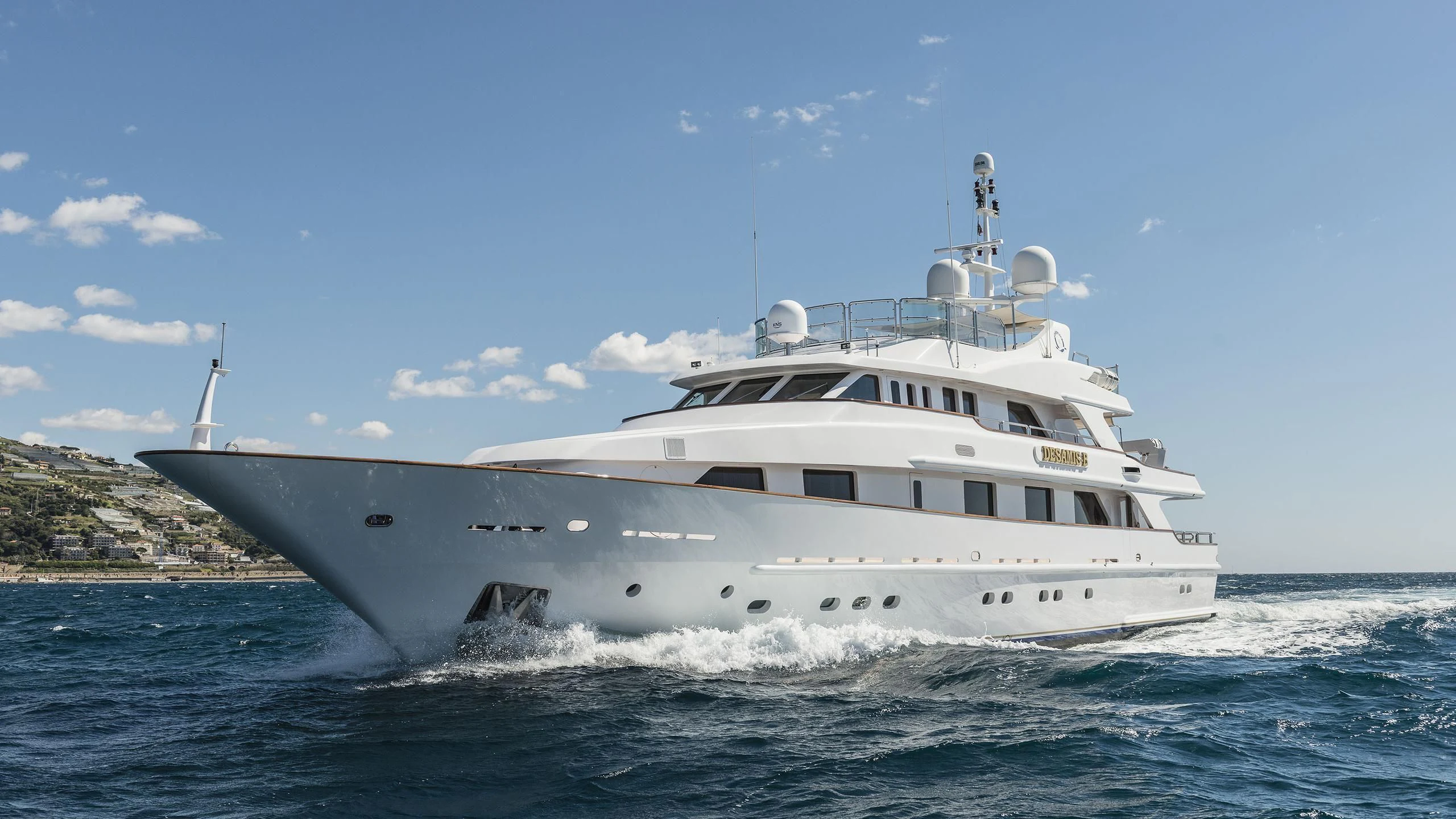 a large white boat on the water aboard DESAMIS B Yacht for Sale