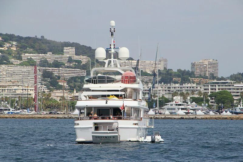 a large white boat in the water aboard DESAMIS B Yacht for Sale