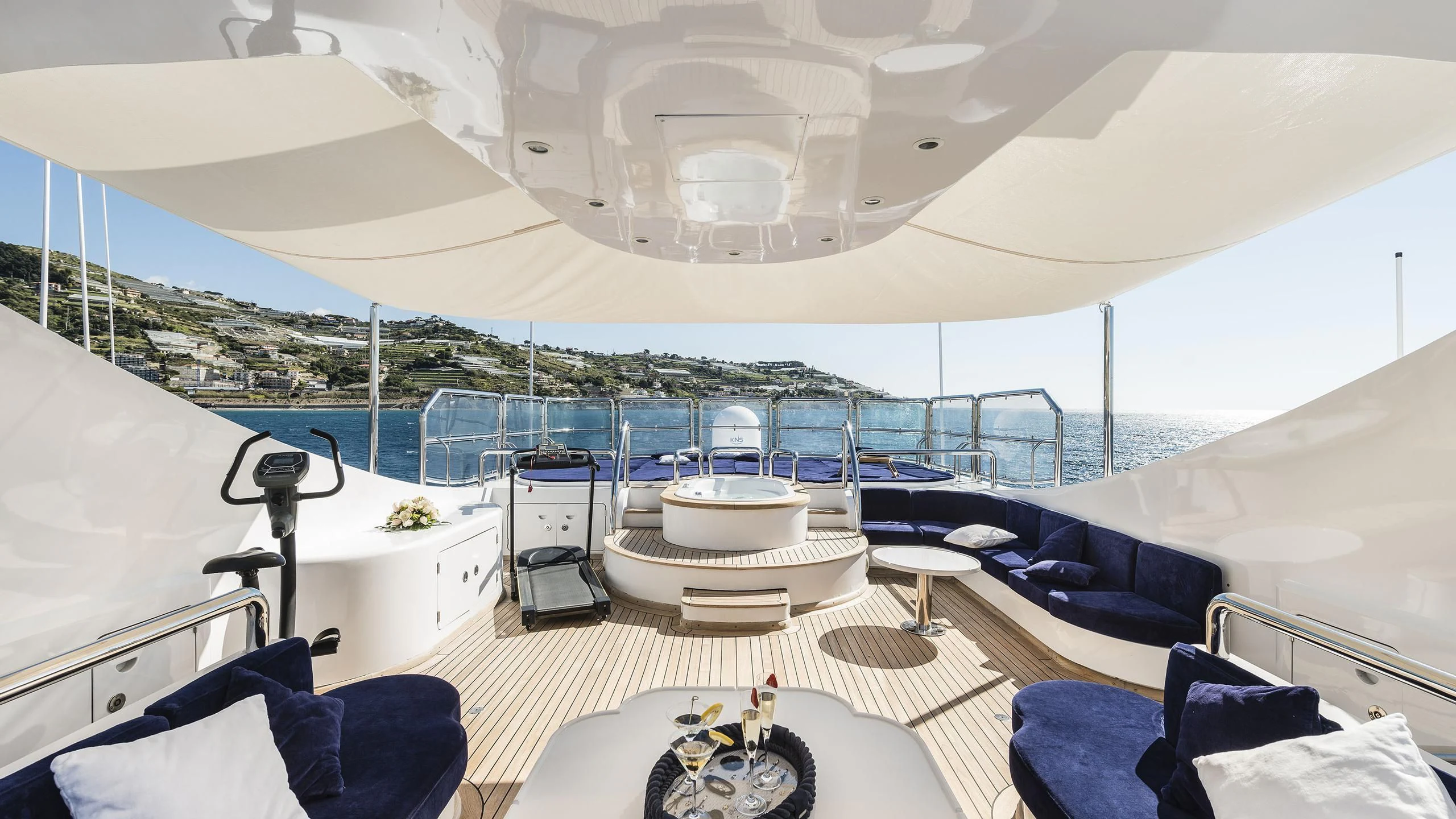 a large white tent with a table and chairs in it aboard DESAMIS B Yacht for Sale