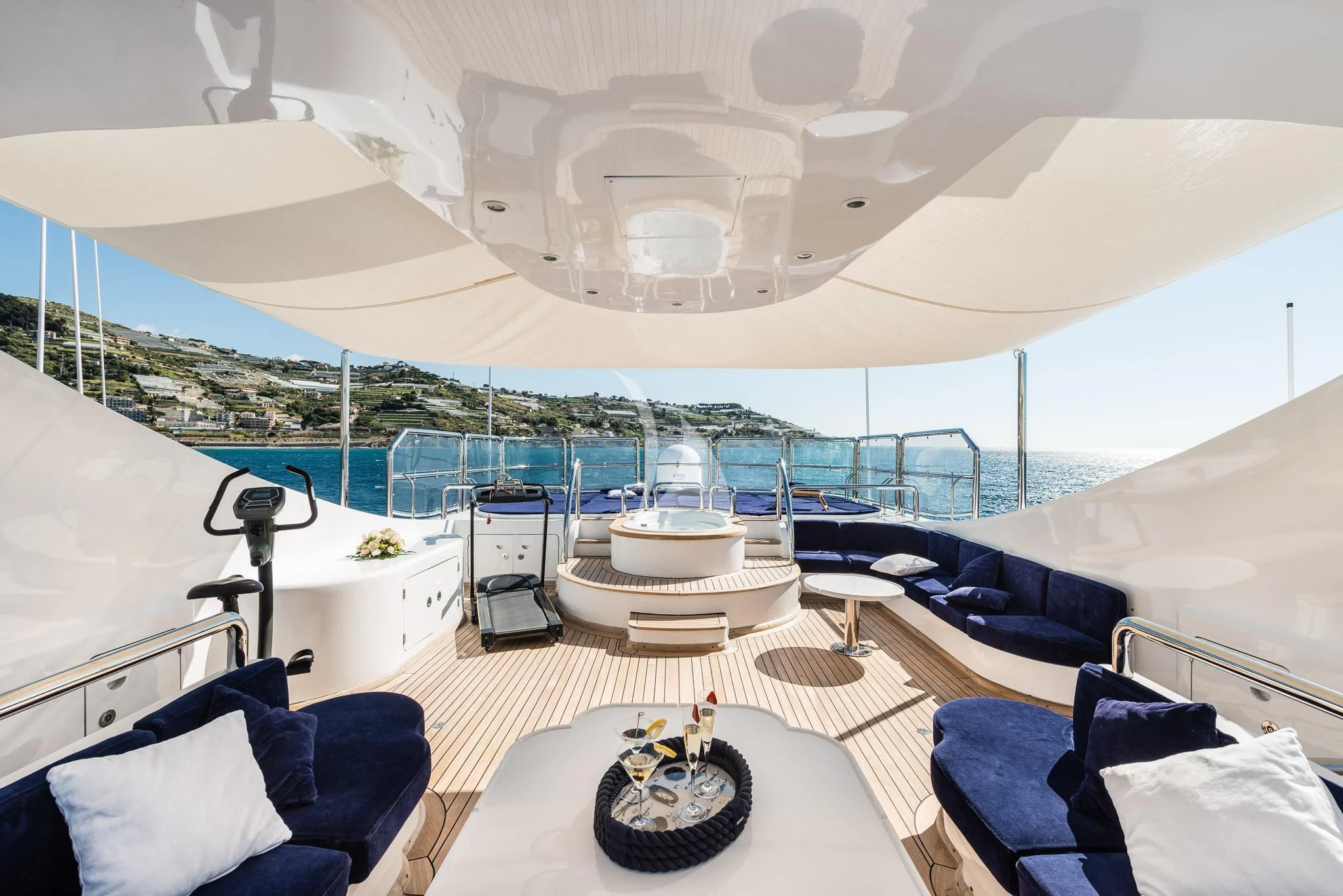 a large white tent with a table and chairs aboard DESAMIS B Yacht for Sale