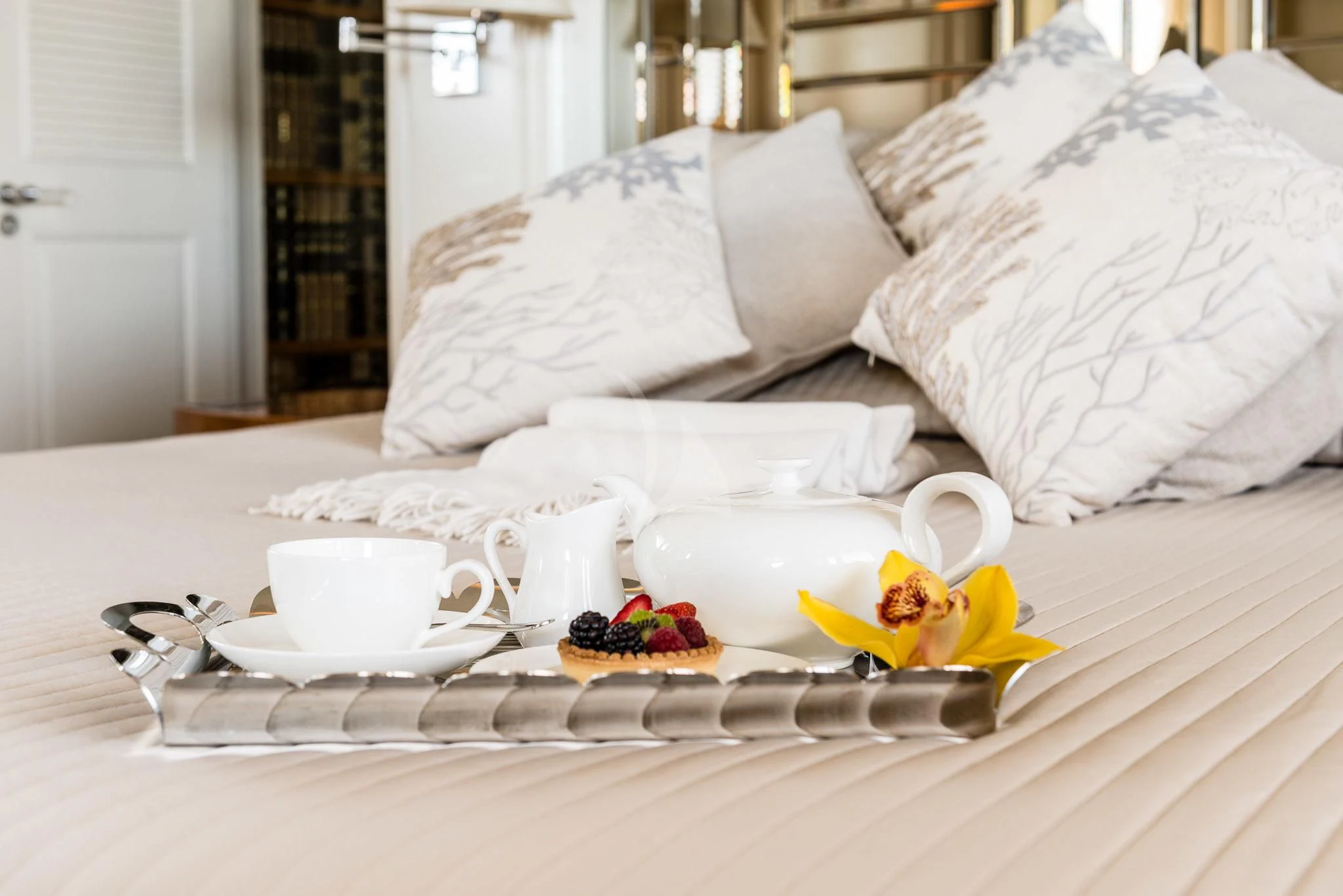 a table with plates and cups on it aboard DESAMIS B Yacht for Sale