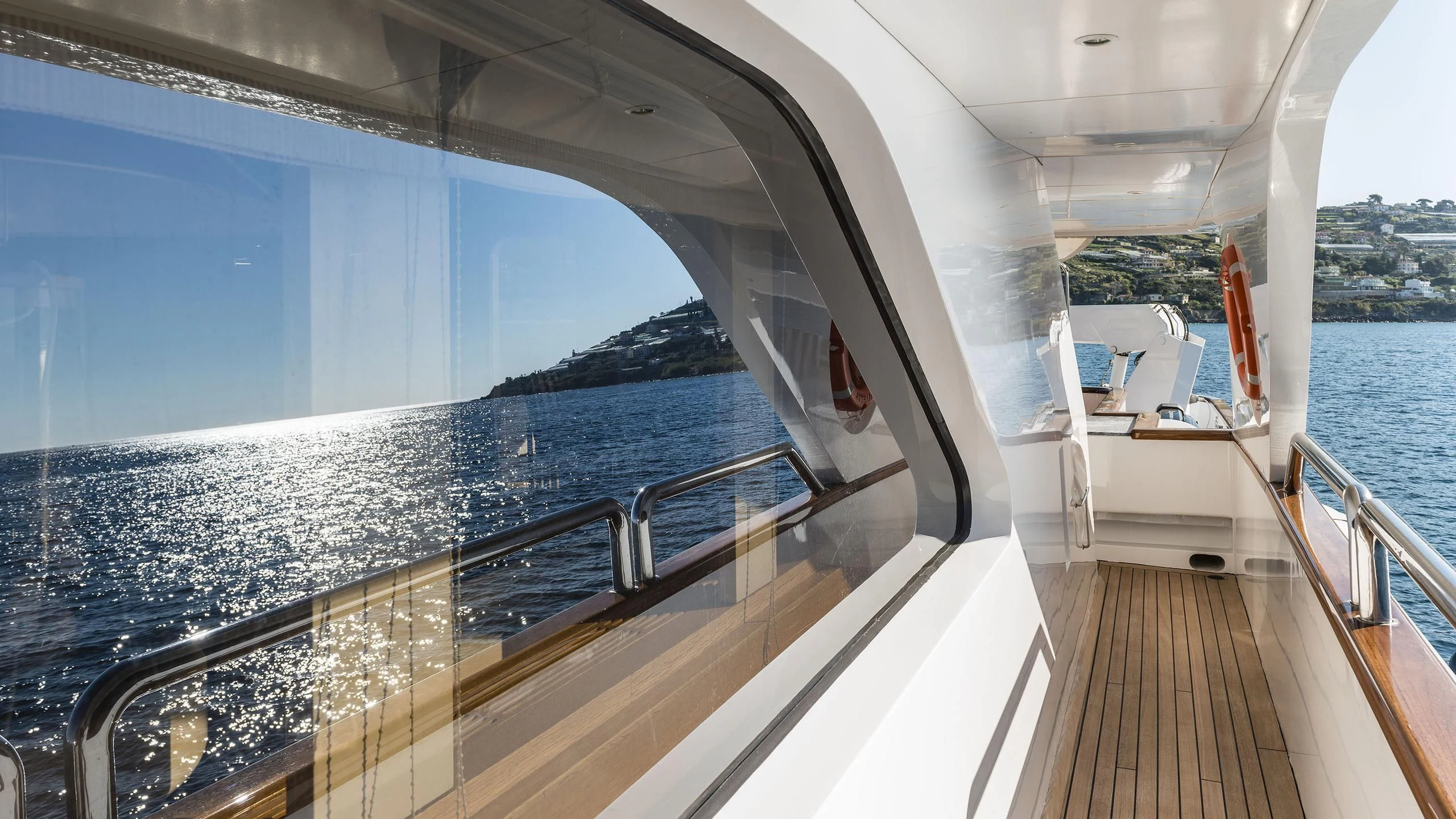 a deck with a large pool aboard DESAMIS B Yacht for Sale