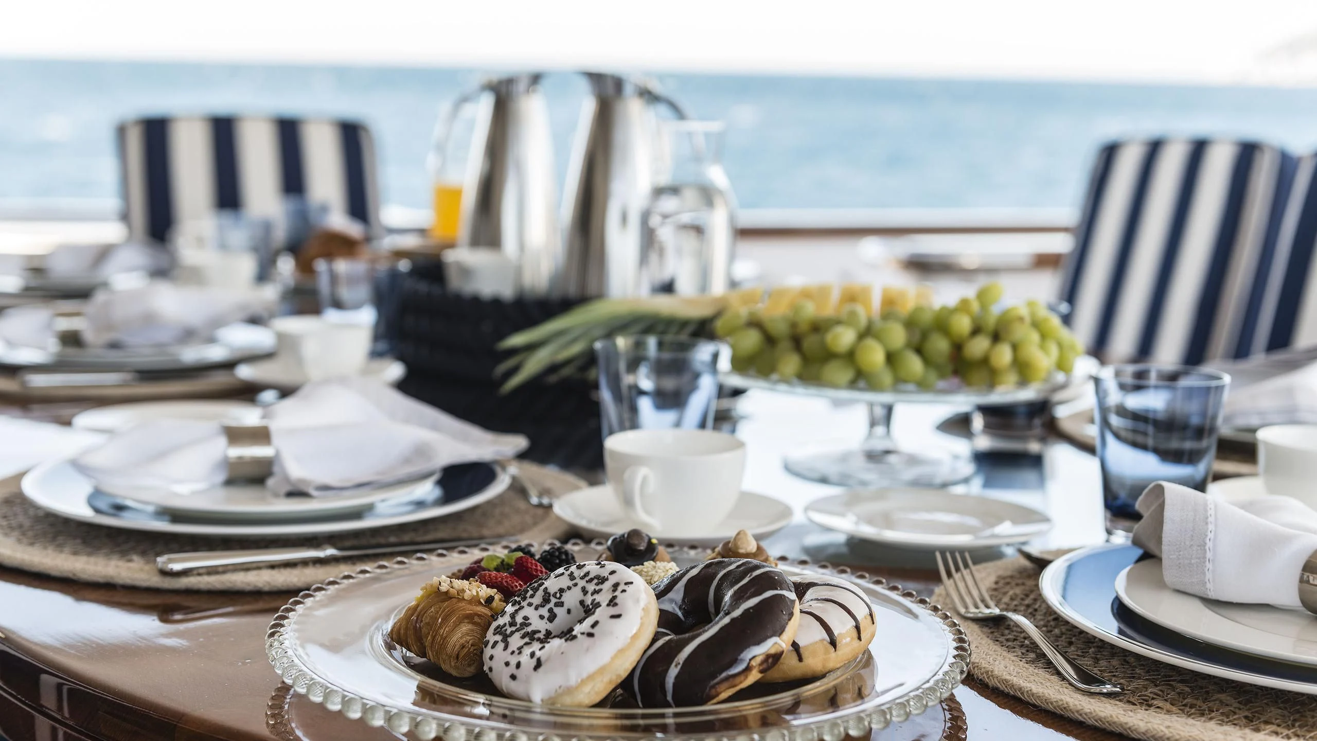 a table with plates and food on it aboard DESAMIS B Yacht for Sale