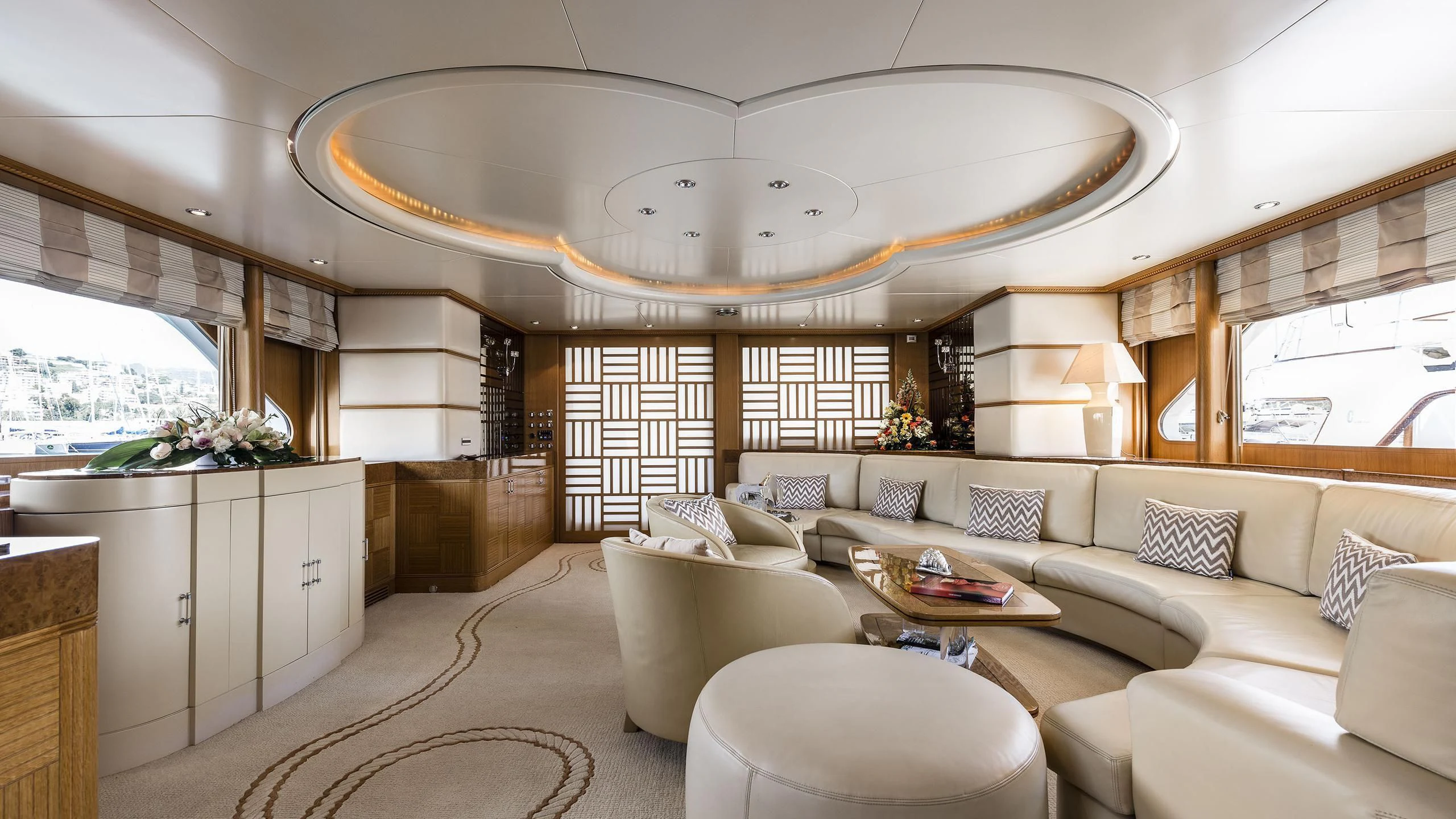 a living room with a large chandelier aboard DESAMIS B Yacht for Sale