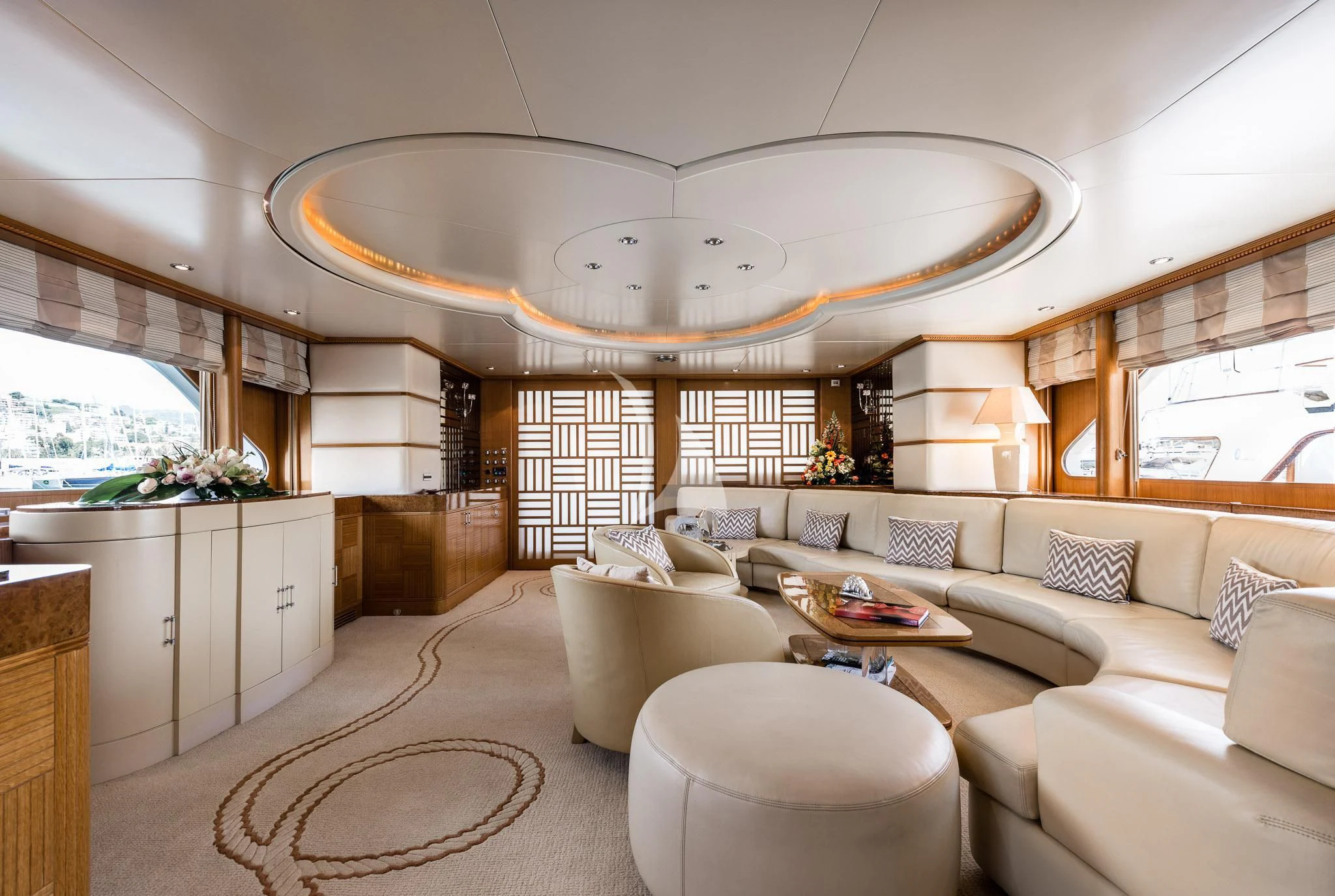 a living room with a large chandelier aboard DESAMIS B Yacht for Sale
