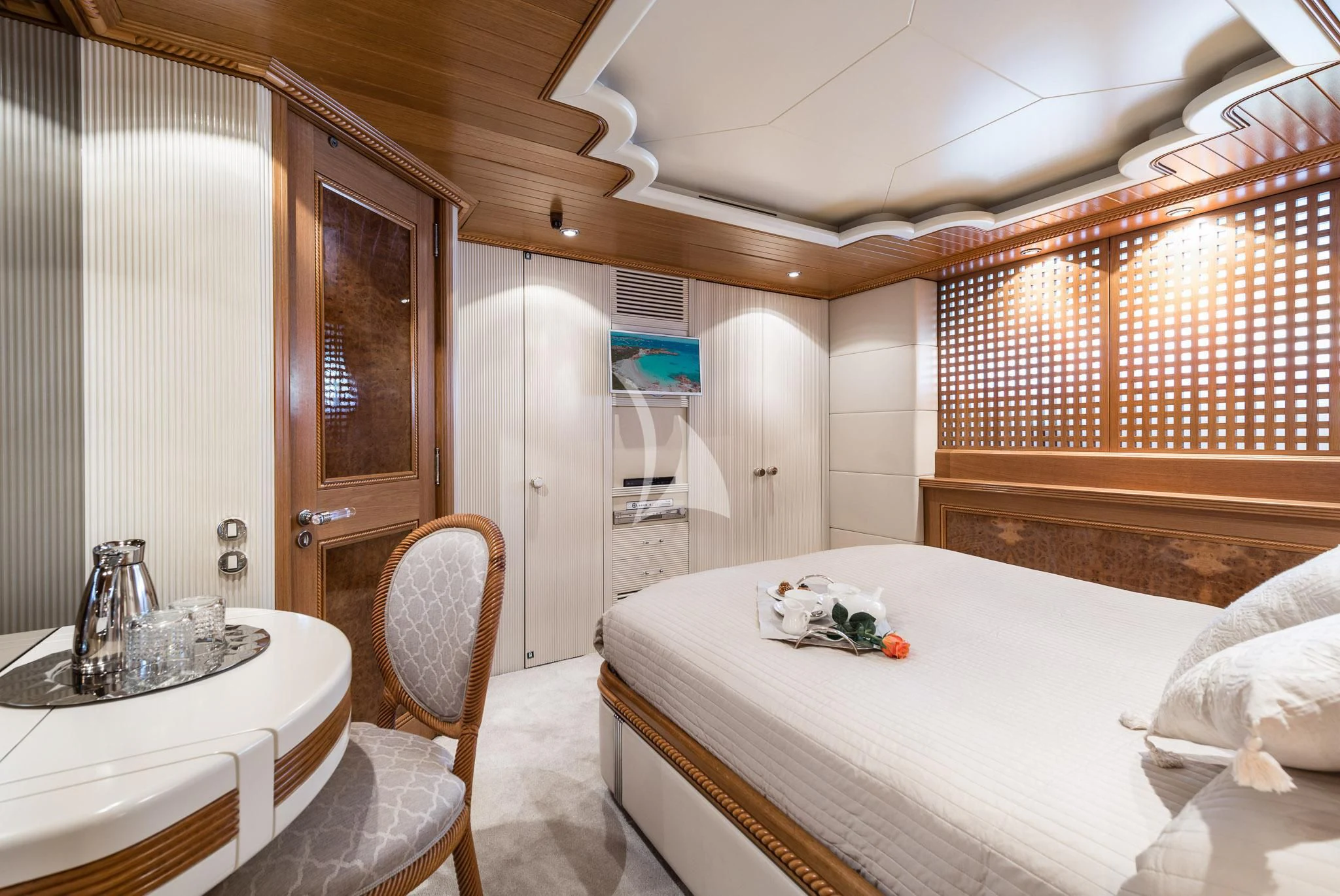 a bedroom with a bed and a sink aboard DESAMIS B Yacht for Sale
