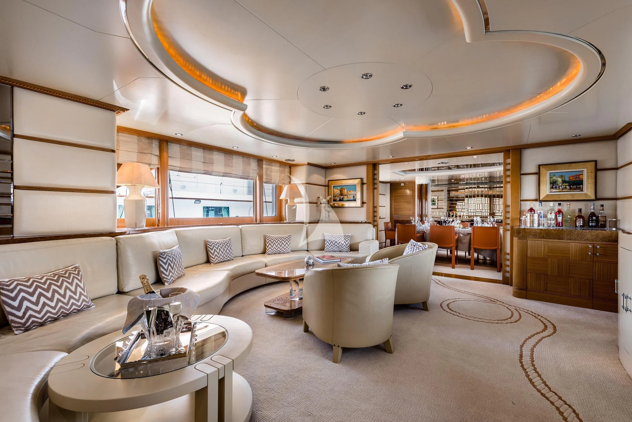 a living room with a large chandelier aboard DESAMIS B Yacht for Sale