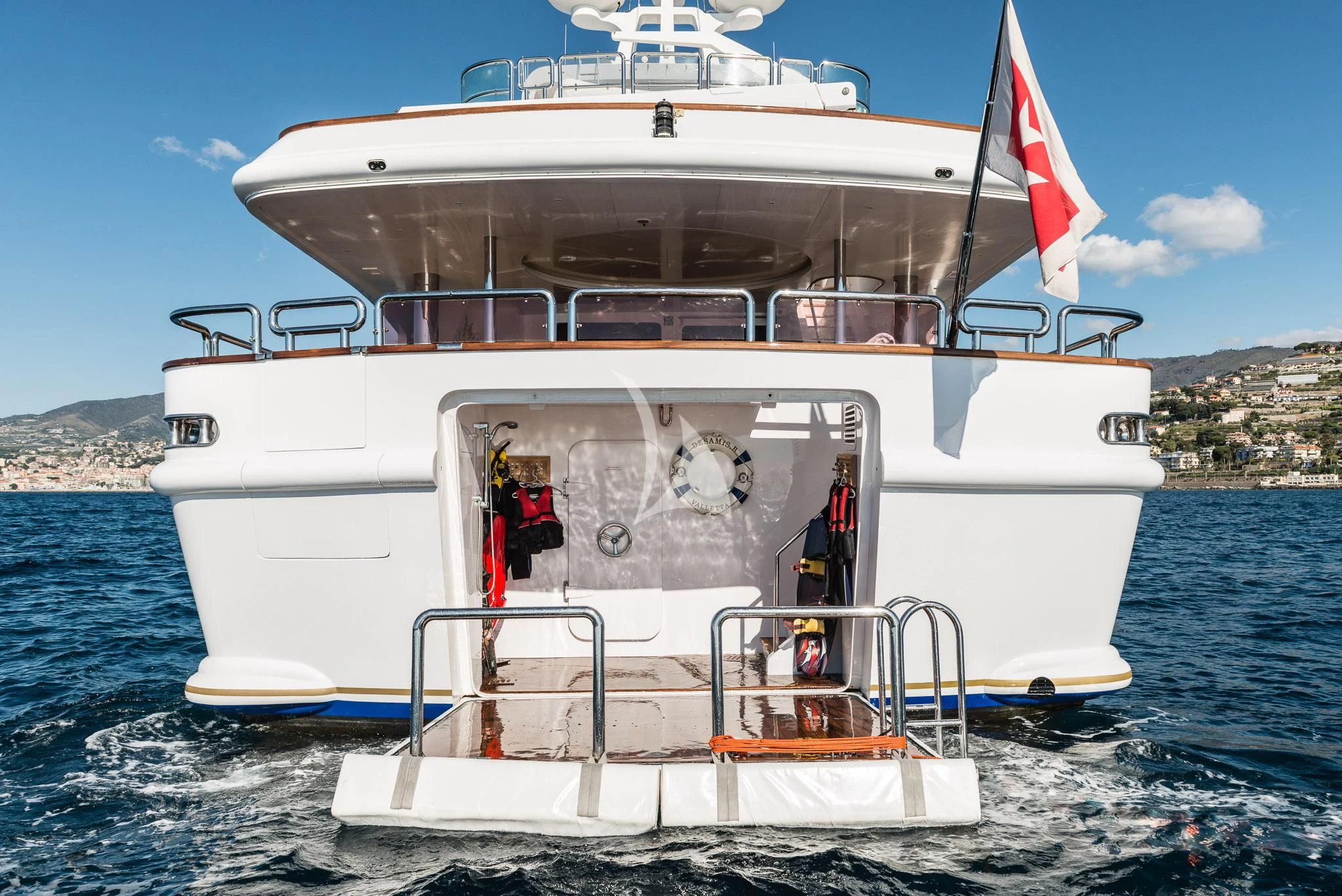 a large white boat in the water aboard DESAMIS B Yacht for Sale