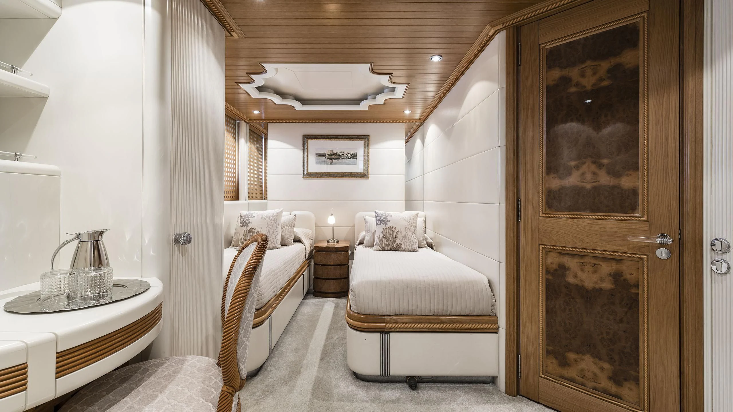 a room with a bed and a table aboard DESAMIS B Yacht for Sale