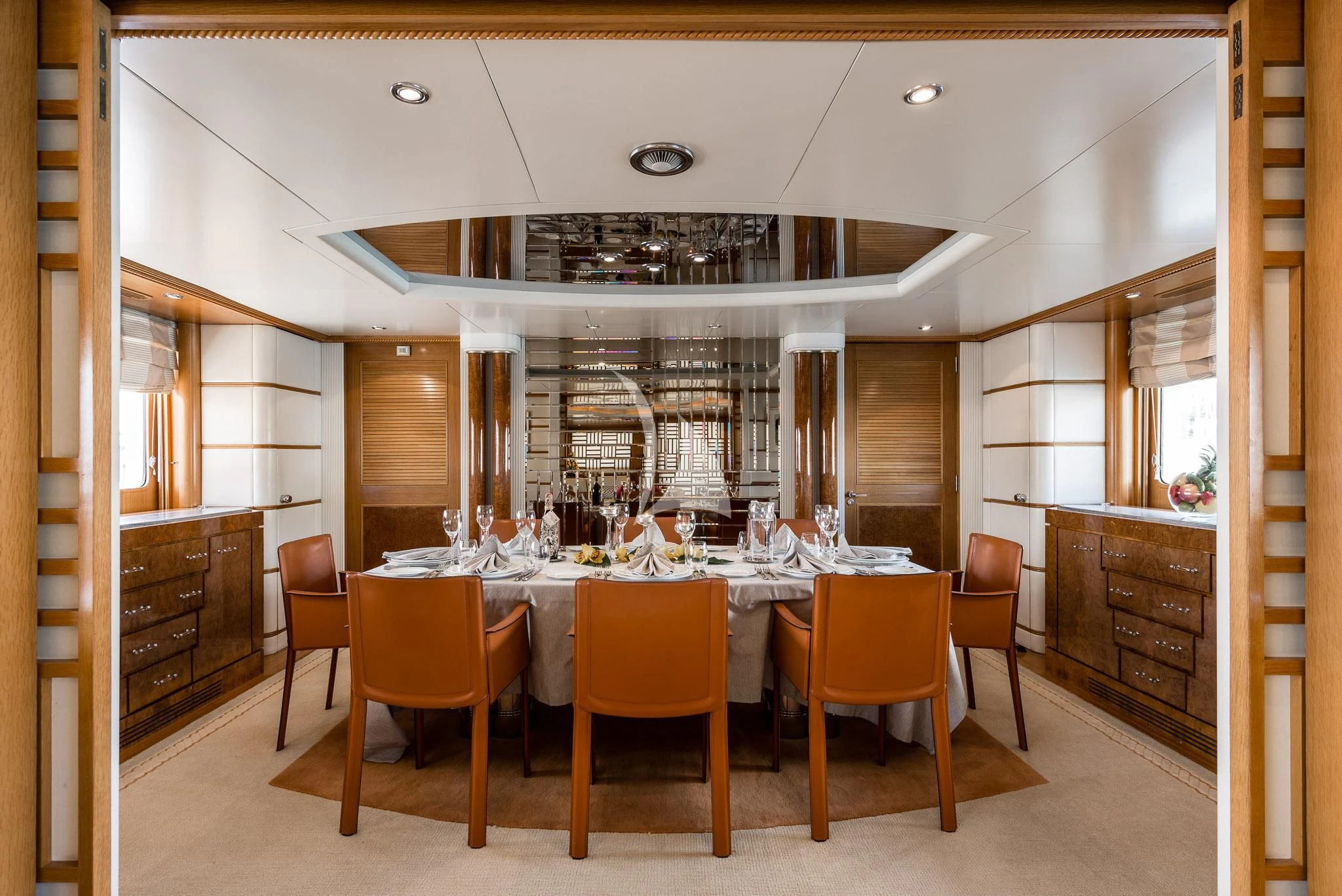 a large kitchen with a table and chairs aboard DESAMIS B Yacht for Sale