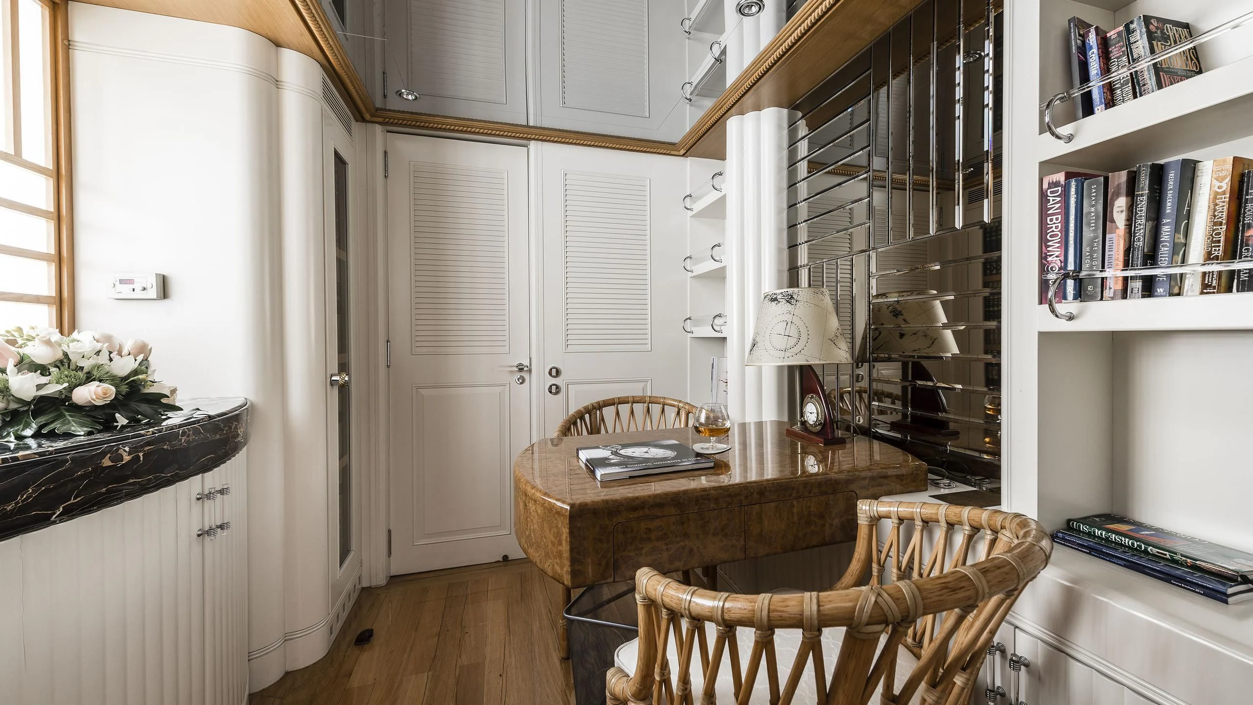 a dining room with a fireplace aboard DESAMIS B Yacht for Sale