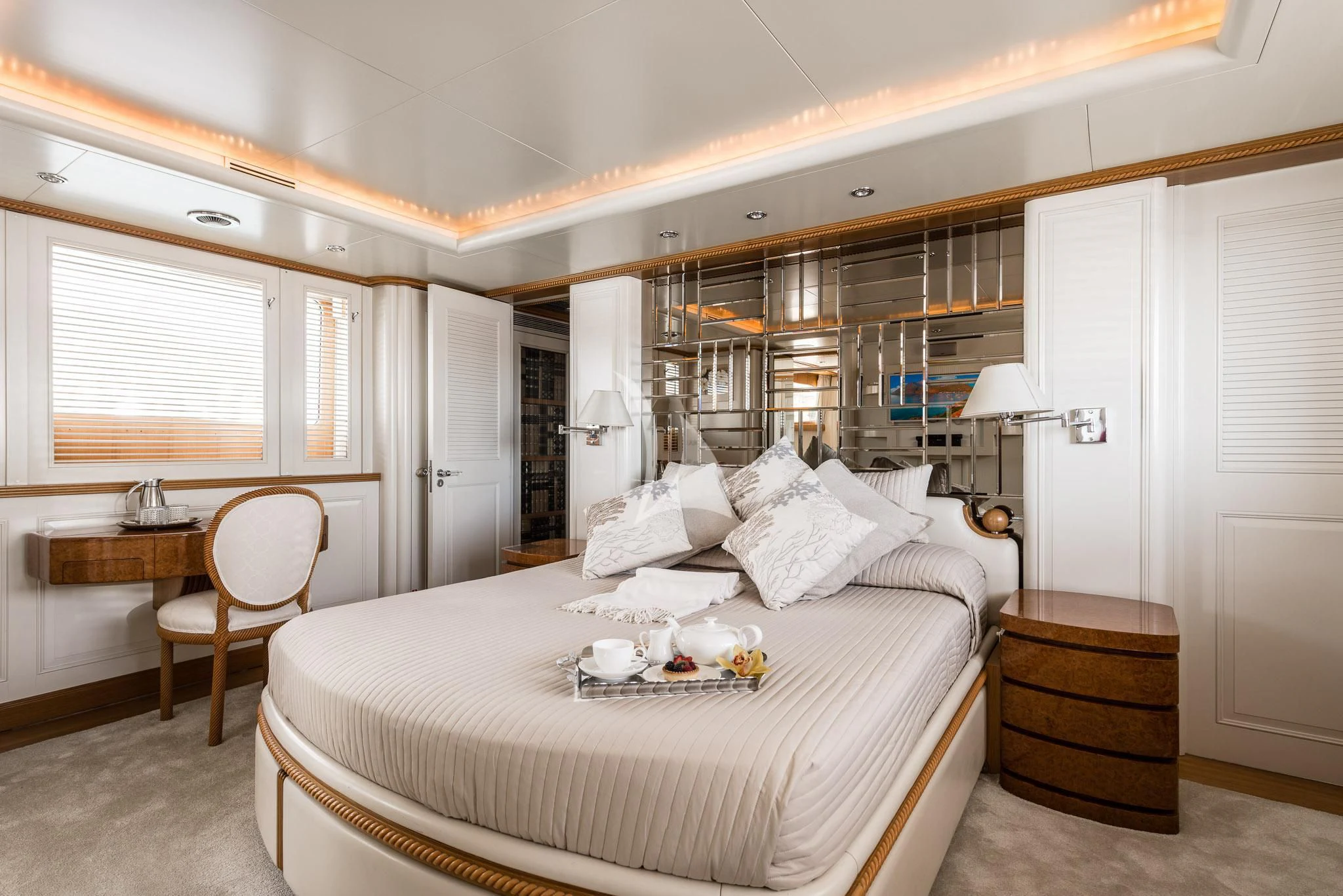 a bedroom with a large bed aboard DESAMIS B Yacht for Sale