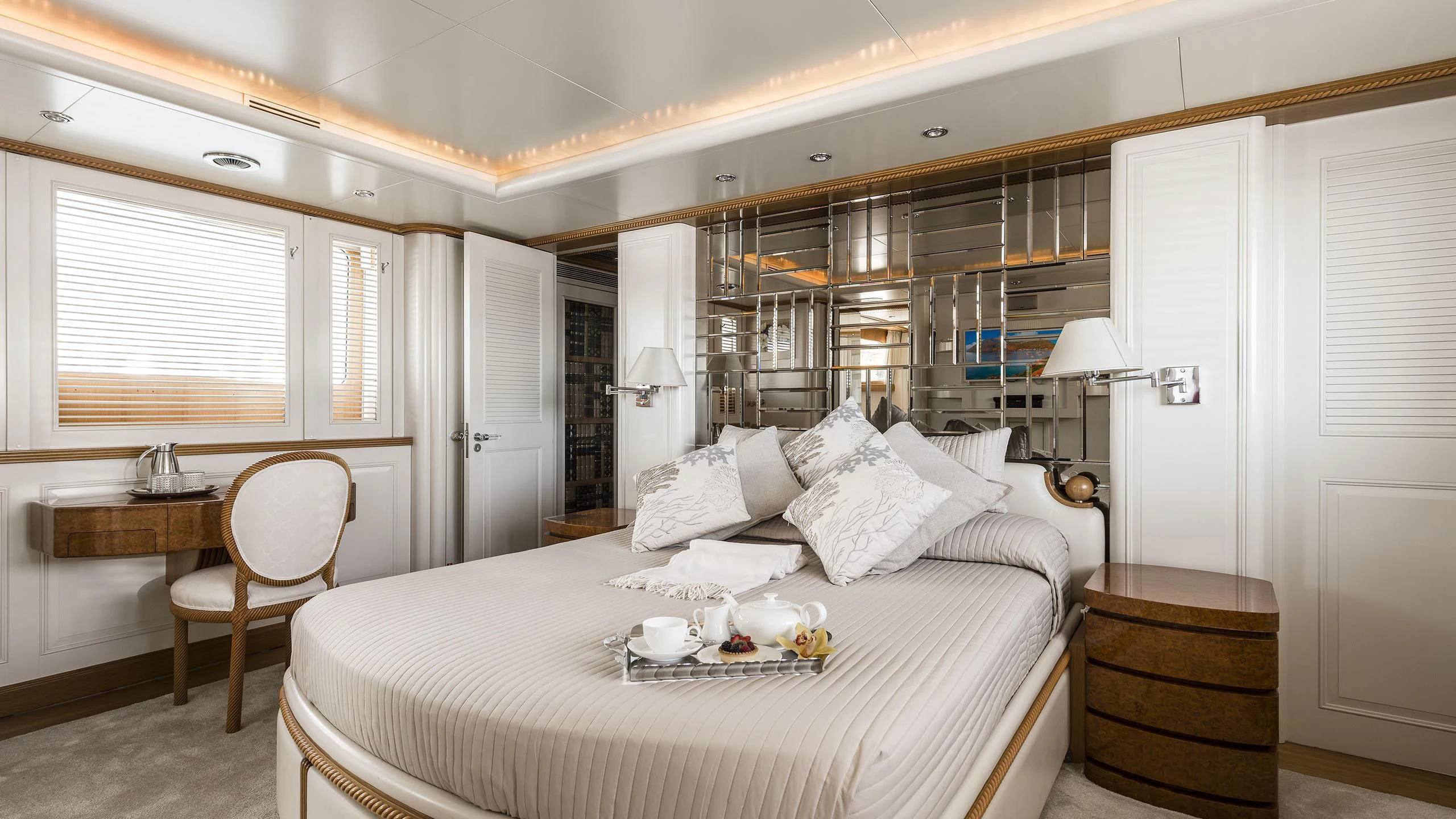 a large bedroom with a large bed aboard DESAMIS B Yacht for Sale