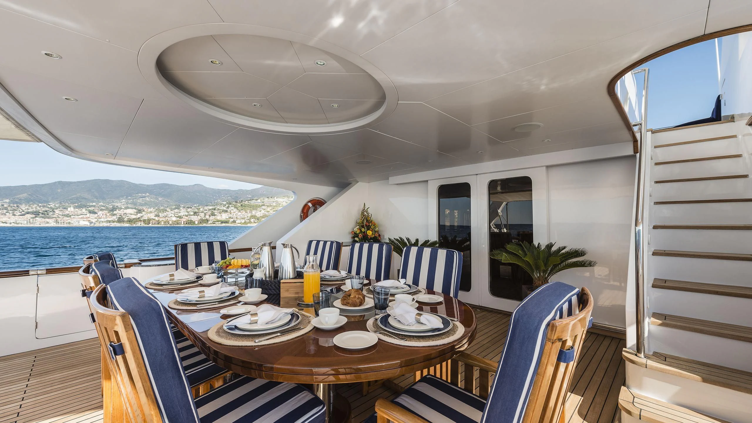 a dining table on a boat aboard DESAMIS B Yacht for Sale