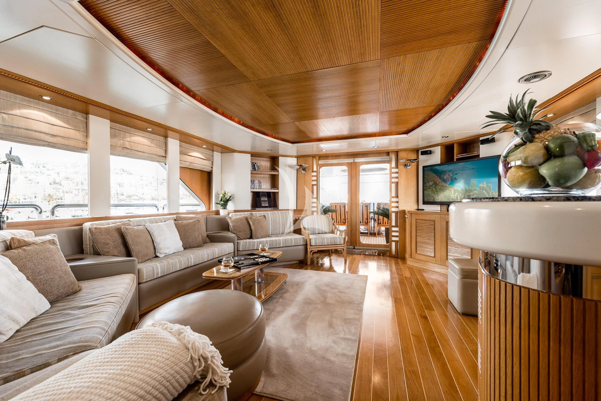 a living room with a large window aboard DESAMIS B Yacht for Sale