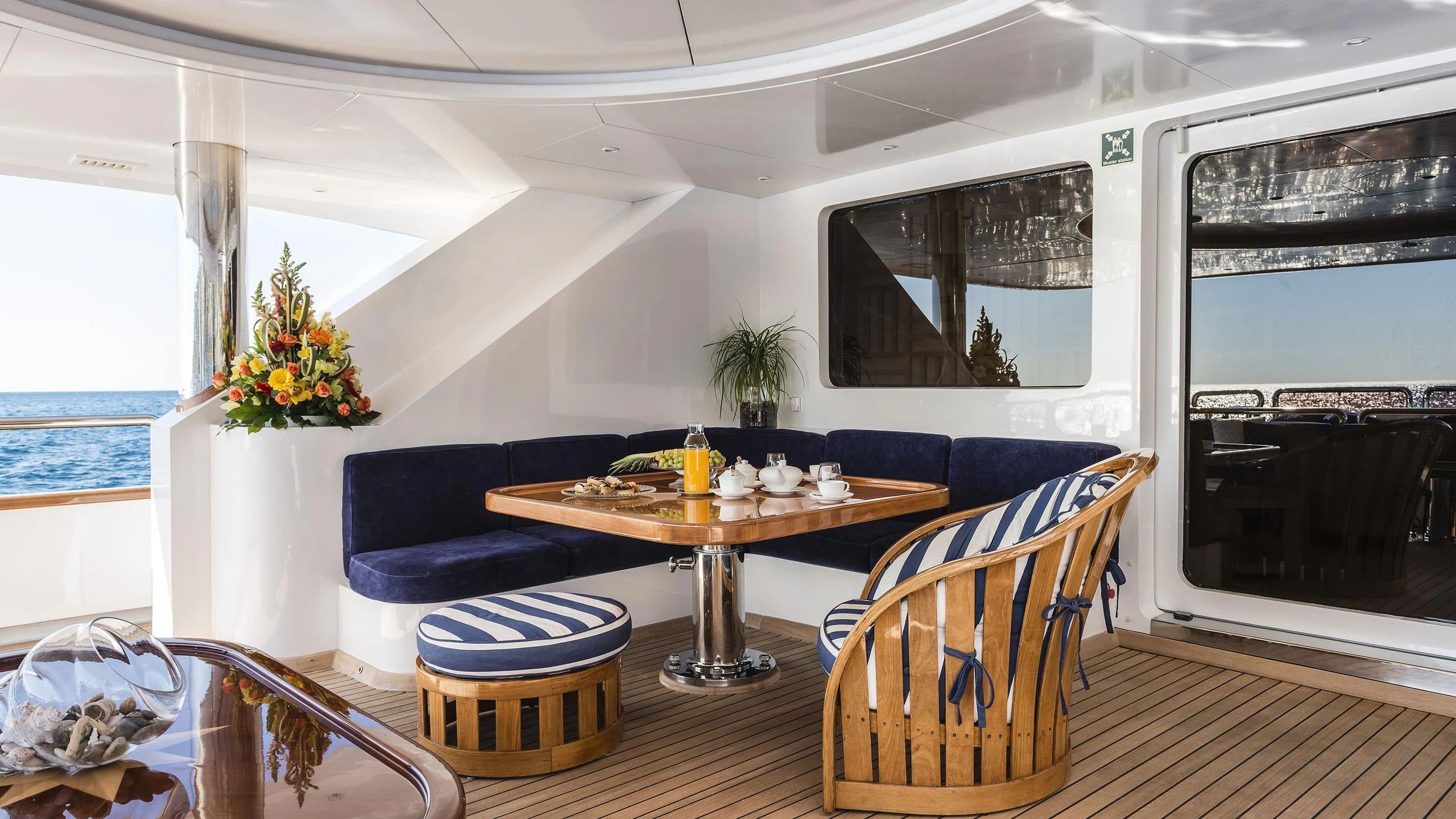 a dining room with a table and chairs aboard DESAMIS B Yacht for Sale