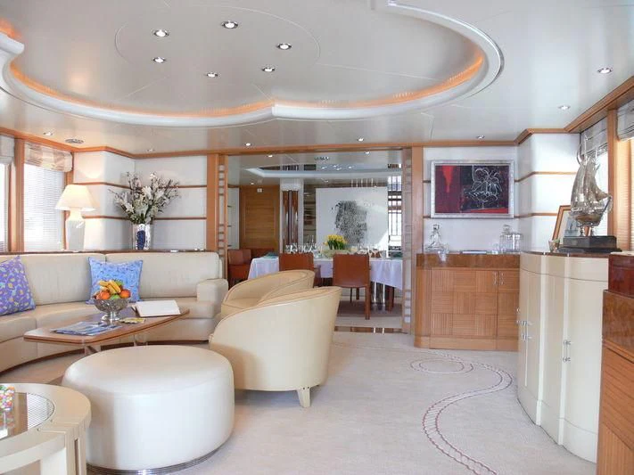 a living room with a large open door aboard DESAMIS B Yacht for Sale