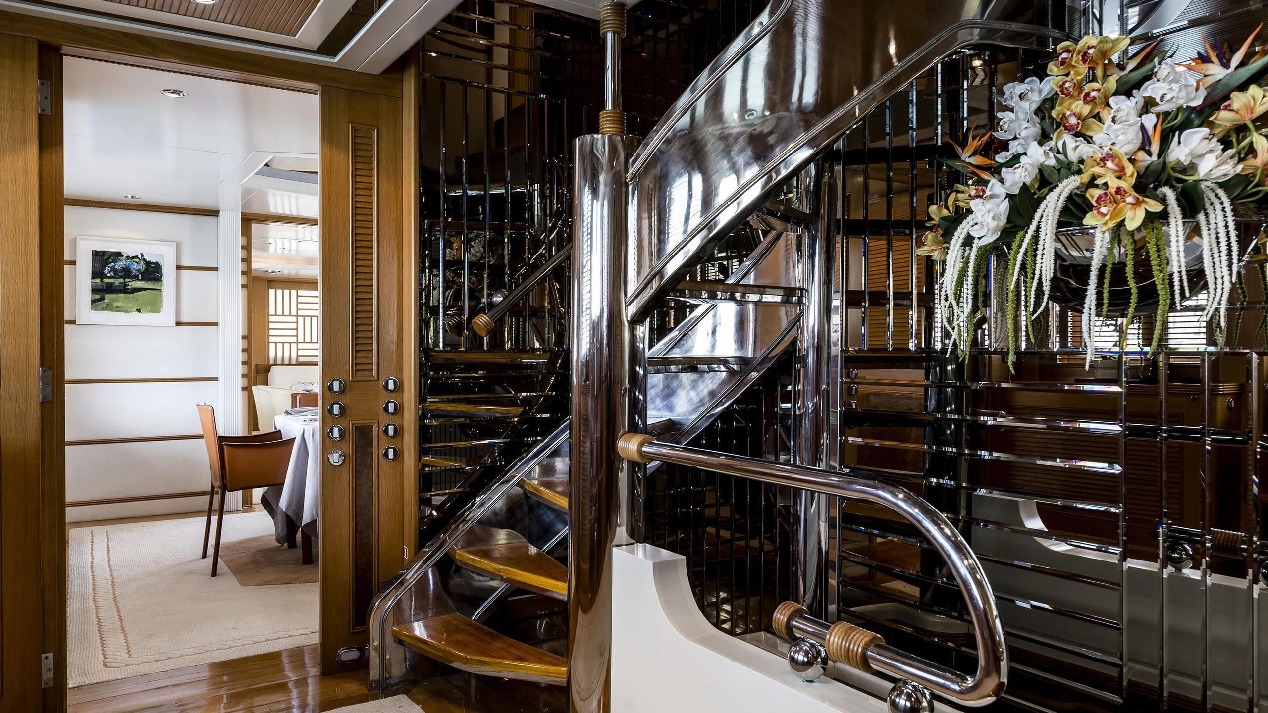 a room with shelves and chairs aboard DESAMIS B Yacht for Sale