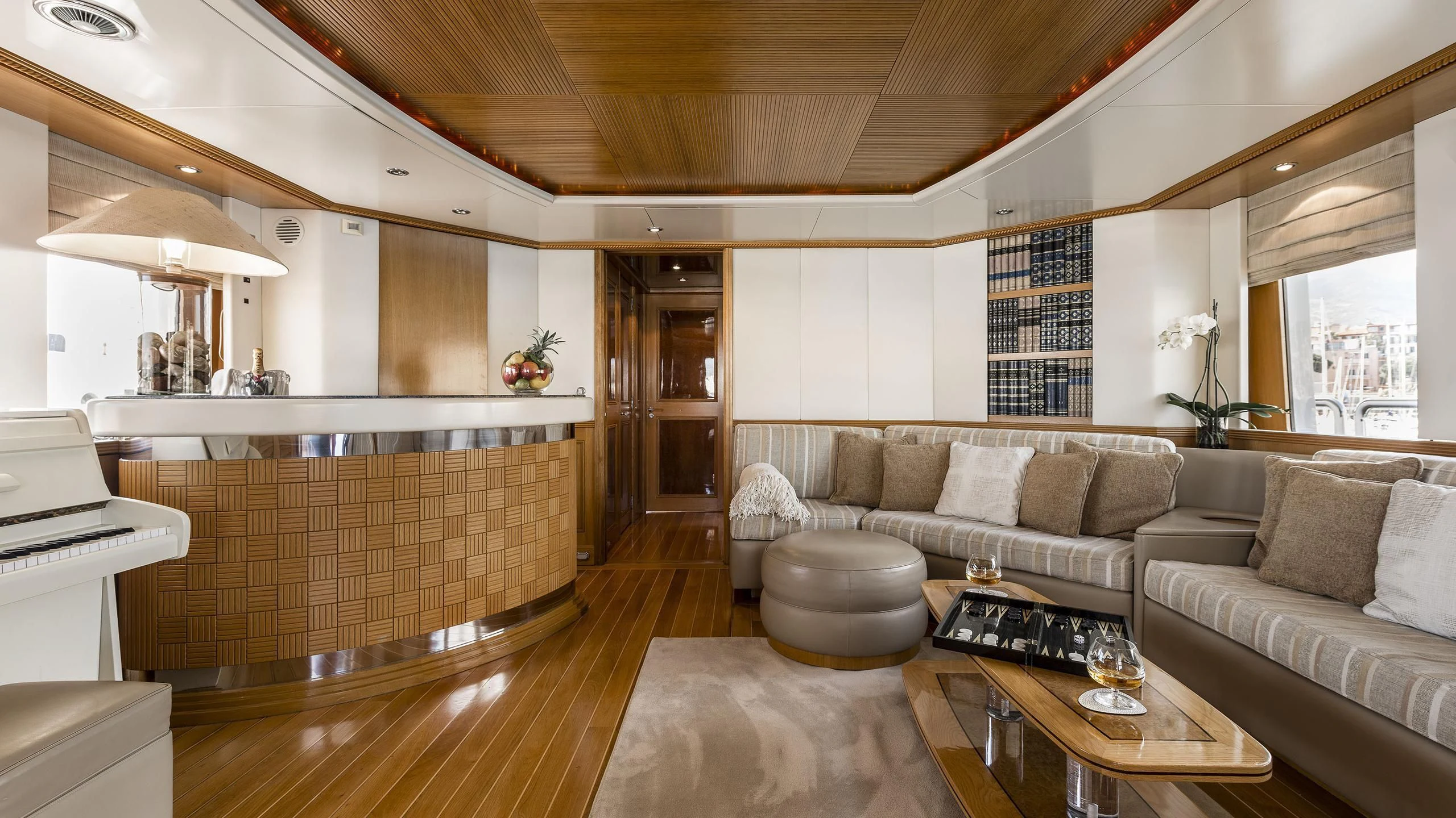 a living room with a couch and a coffee table aboard DESAMIS B Yacht for Sale