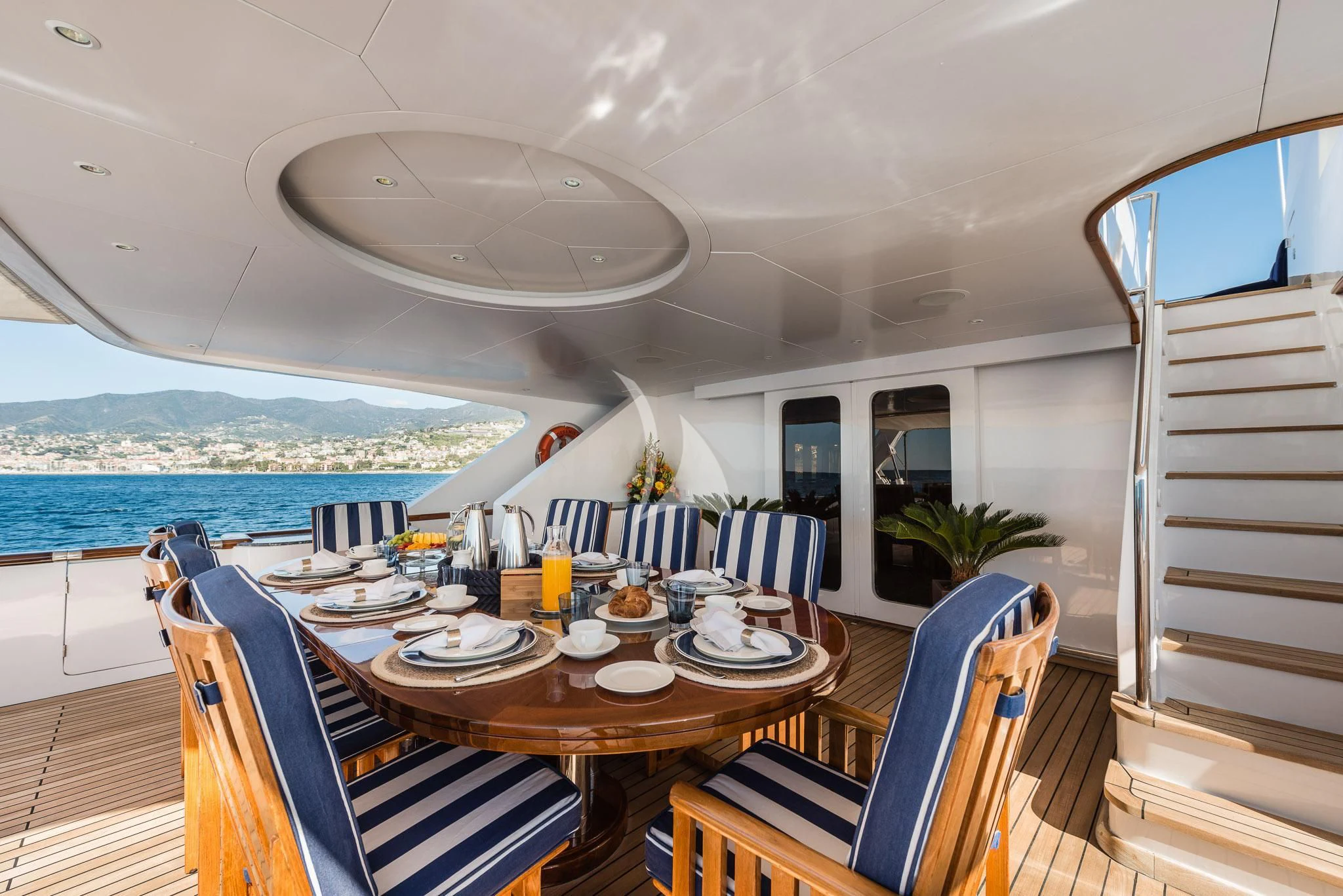 a dining table on a boat aboard DESAMIS B Yacht for Sale