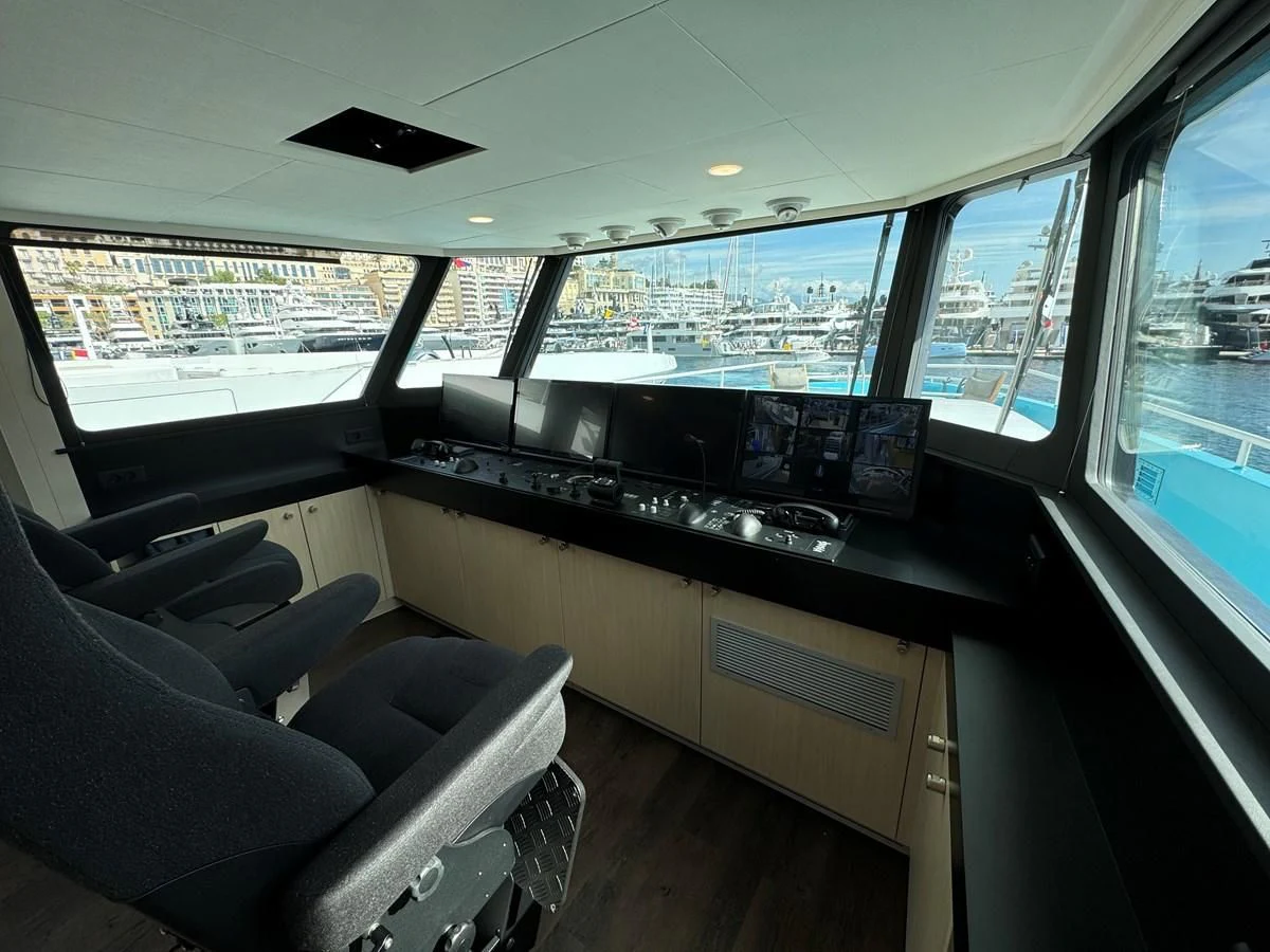 inside of a vehicle with a large window and a view of the city aboard FIVE OCEANS Yacht for Sale
