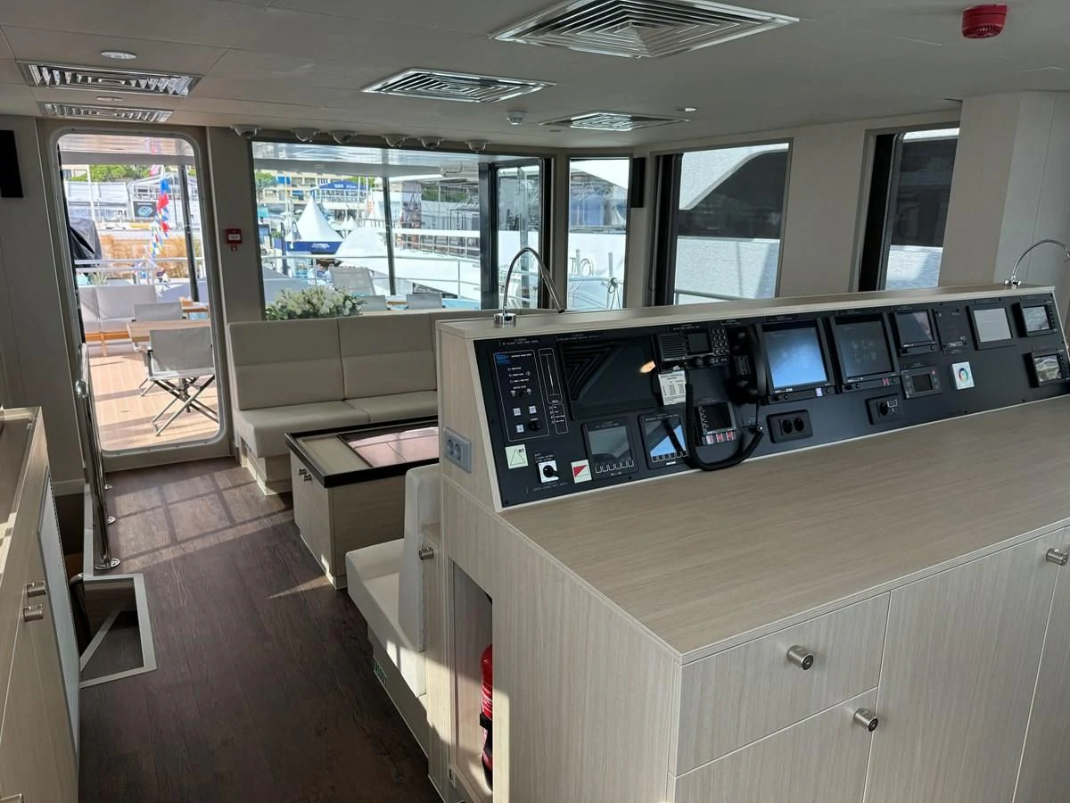 a large room with a large counter and a large window aboard FIVE OCEANS Yacht for Sale