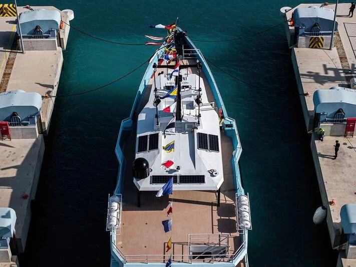 a boat docked at a pier aboard FIVE OCEANS Yacht for Sale
