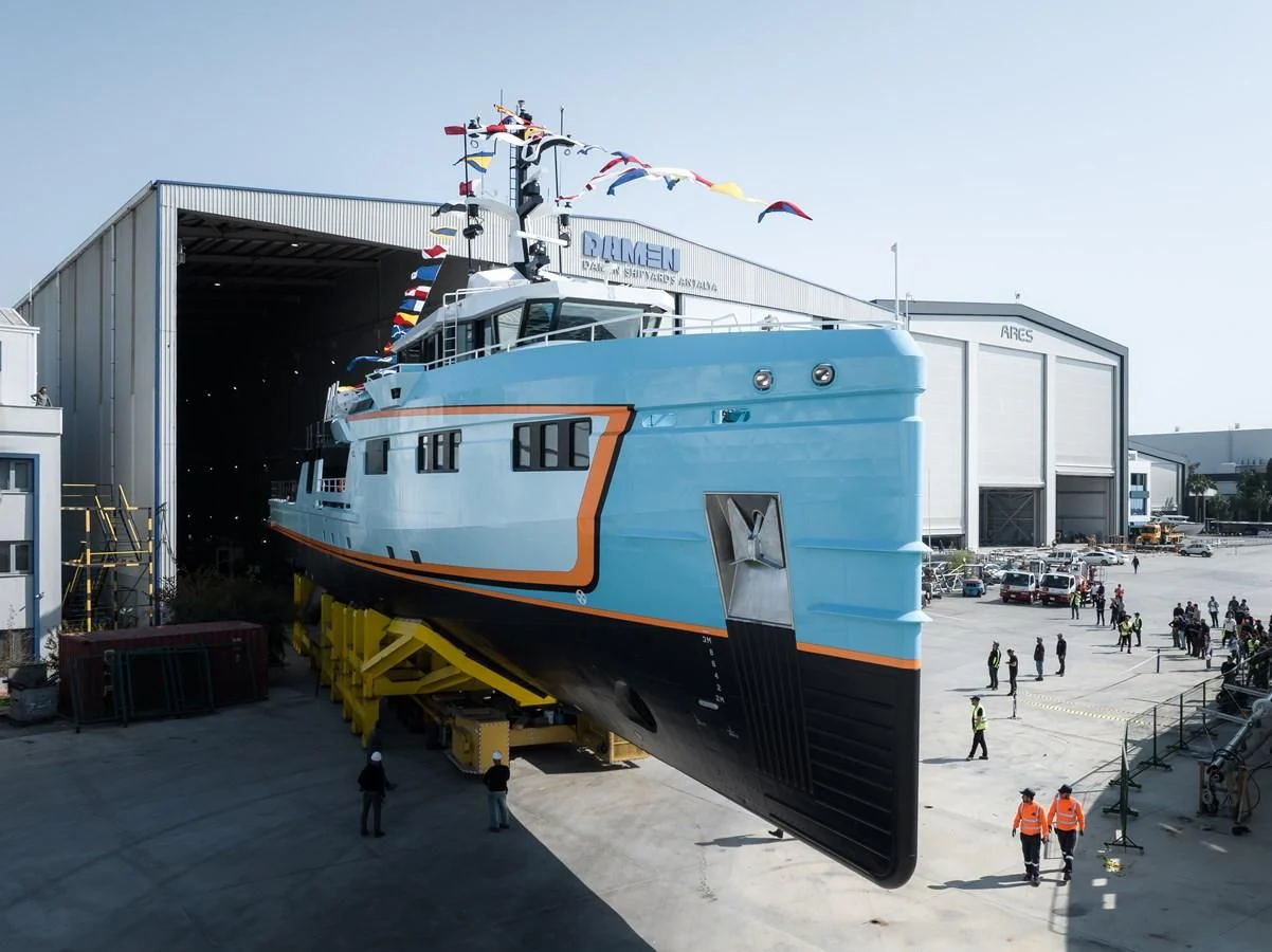 a large boat docked at a pier aboard FIVE OCEANS Yacht for Sale
